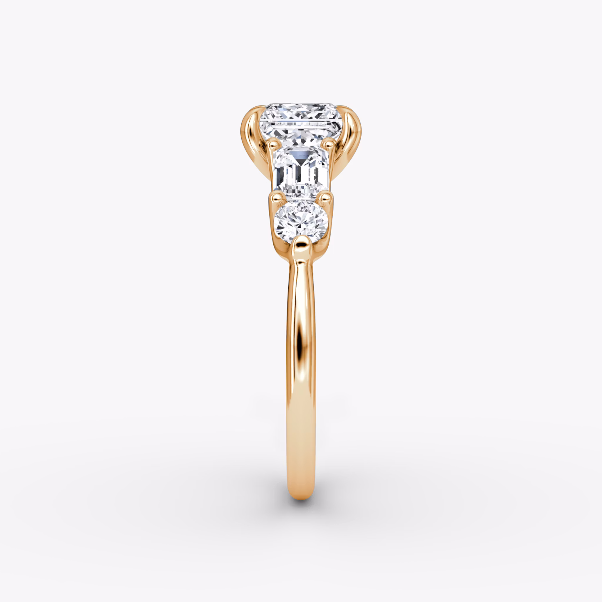 The Mixed Shape | Princess | 14k | Rose Gold | bandAccent: Plain | sideStoneOrientation: horizontal | sideStoneShape: Emerald and Round Brilliant | diamondOrientation: vertical | caratWeight: other