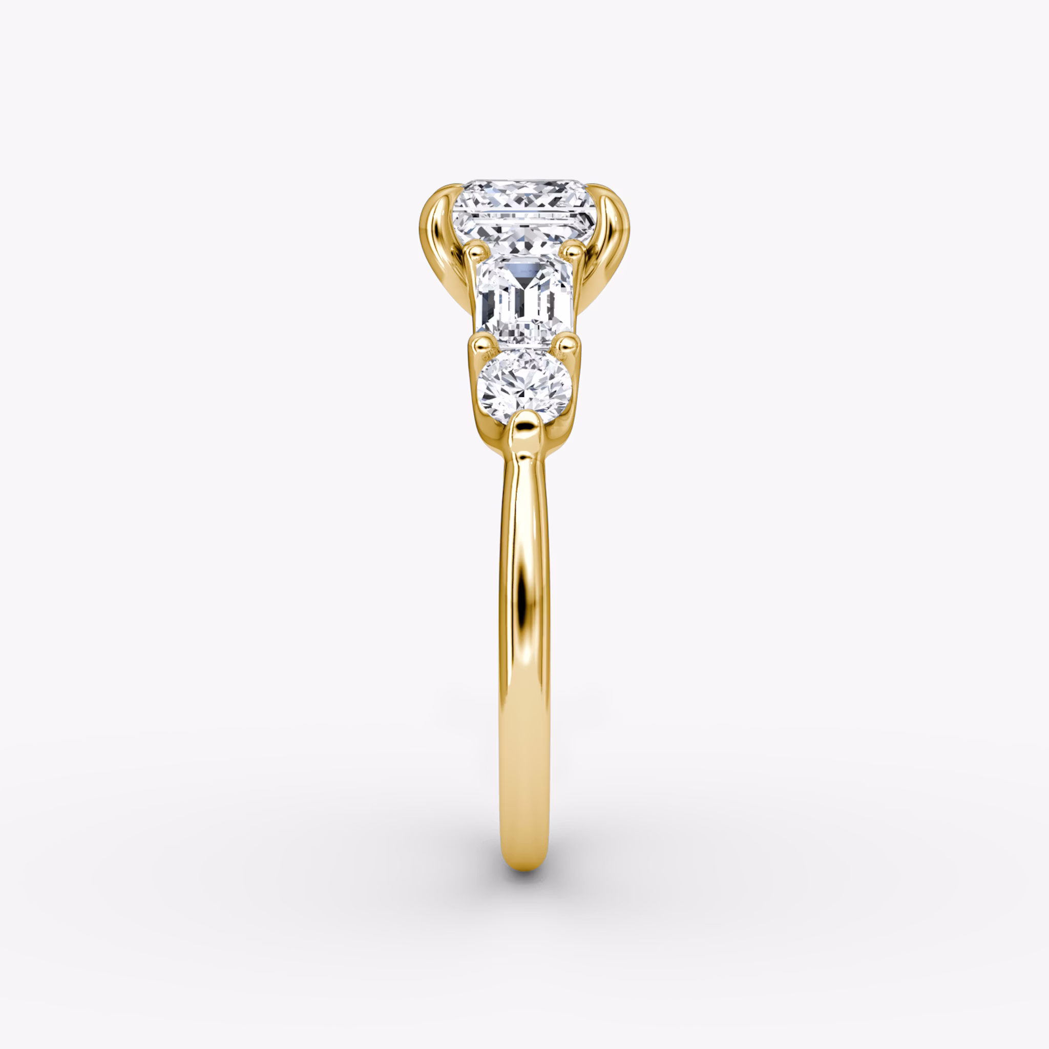 The Mixed Shape | Princess | 18k | Yellow Gold | bandAccent: Plain | sideStoneOrientation: horizontal | sideStoneShape: Emerald and Round Brilliant | diamondOrientation: vertical | caratWeight: other