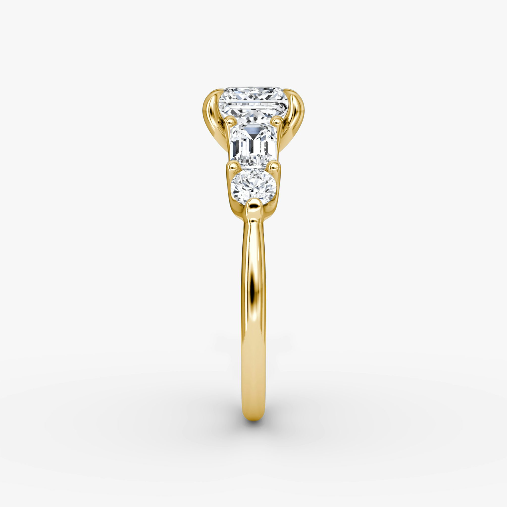 The Mixed Shape | Princess | 18k | Yellow Gold | bandAccent: Plain | sideStoneOrientation: horizontal | sideStoneShape: Emerald and Round Brilliant | diamondOrientation: vertical | caratWeight: other