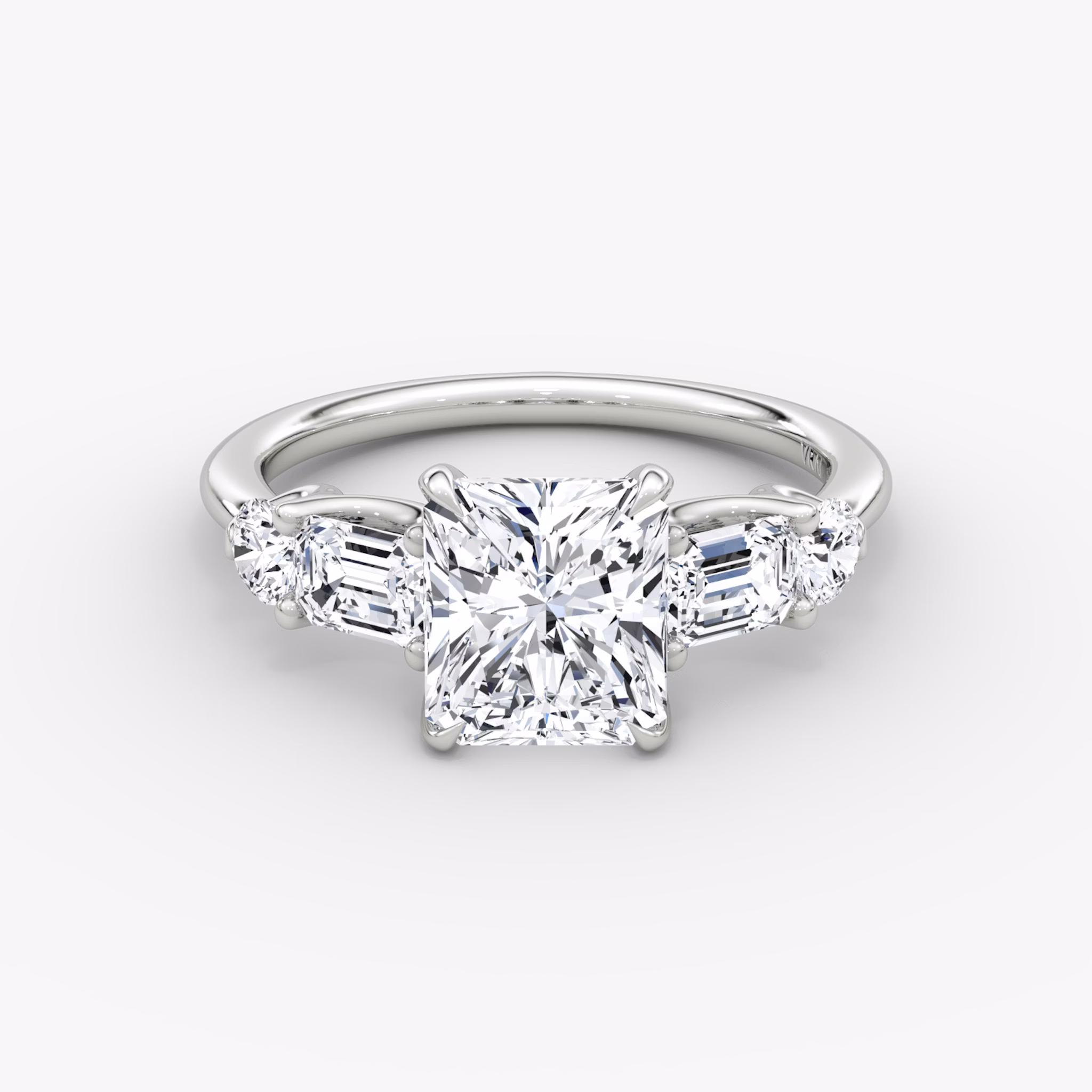The Mixed Shape | Radiant | 18k | White Gold | bandAccent: Plain | sideStoneOrientation: horizontal | sideStoneShape: Emerald and Round Brilliant | diamondOrientation: vertical | caratWeight: other