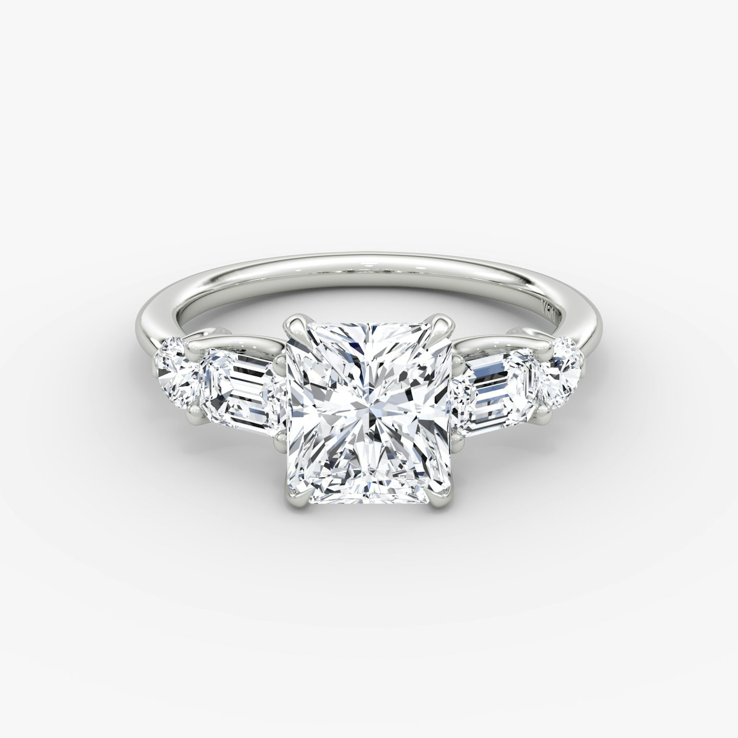 The Mixed Shape | Radiant | Platinum | bandAccent: Plain | sideStoneOrientation: horizontal | sideStoneShape: Emerald and Round Brilliant | diamondOrientation: vertical | caratWeight: other