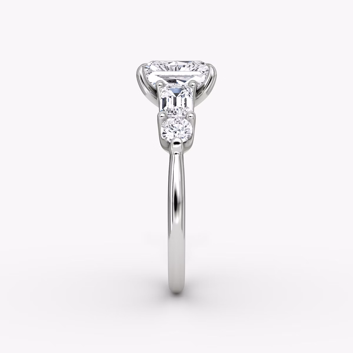 The Mixed Shape | Radiant | Platinum | bandAccent: Plain | sideStoneOrientation: horizontal | sideStoneShape: Emerald and Round Brilliant | diamondOrientation: vertical | caratWeight: other