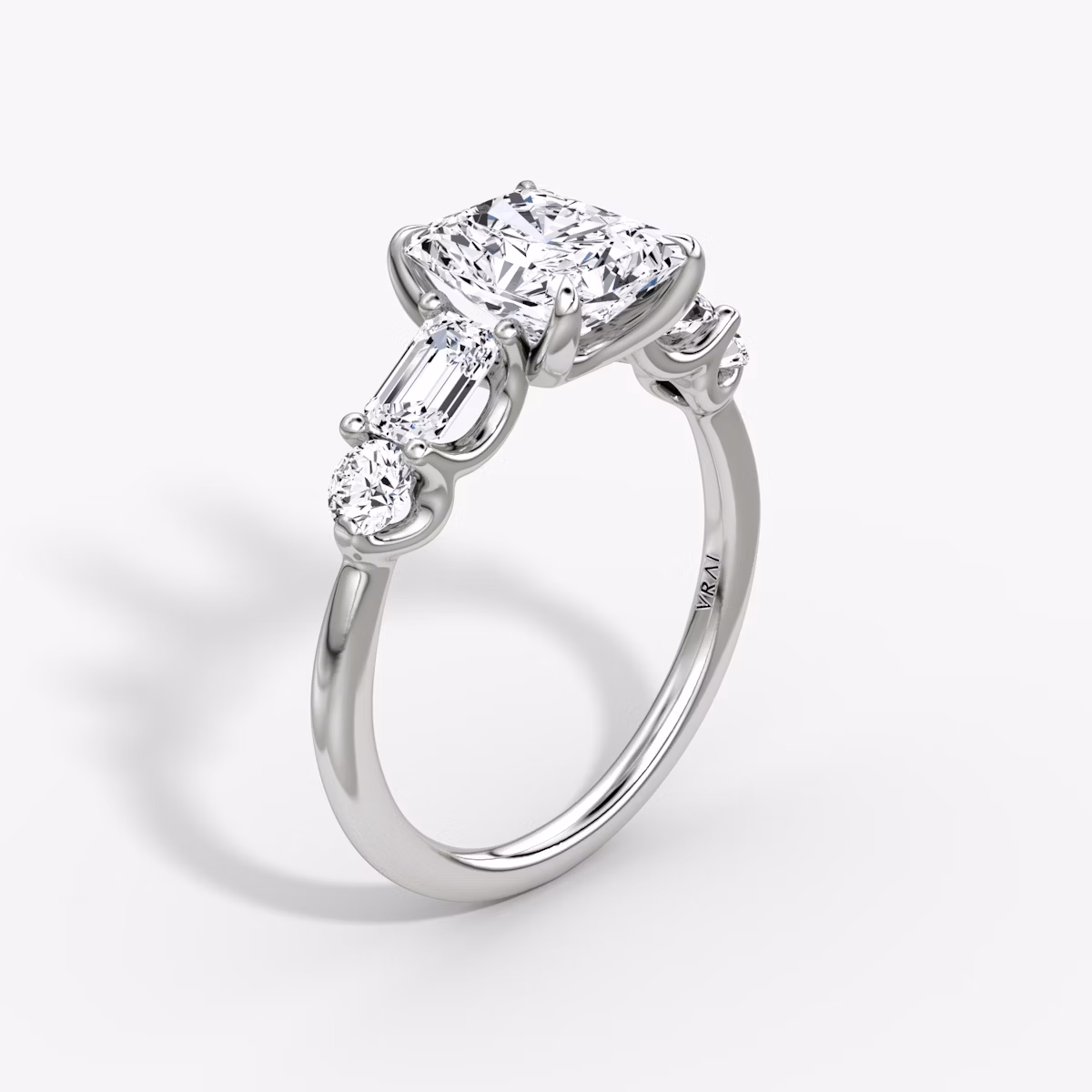 The Mixed Shape | Radiant | Platinum | bandAccent: Plain | sideStoneOrientation: horizontal | sideStoneShape: Emerald and Round Brilliant | diamondOrientation: vertical | caratWeight: other