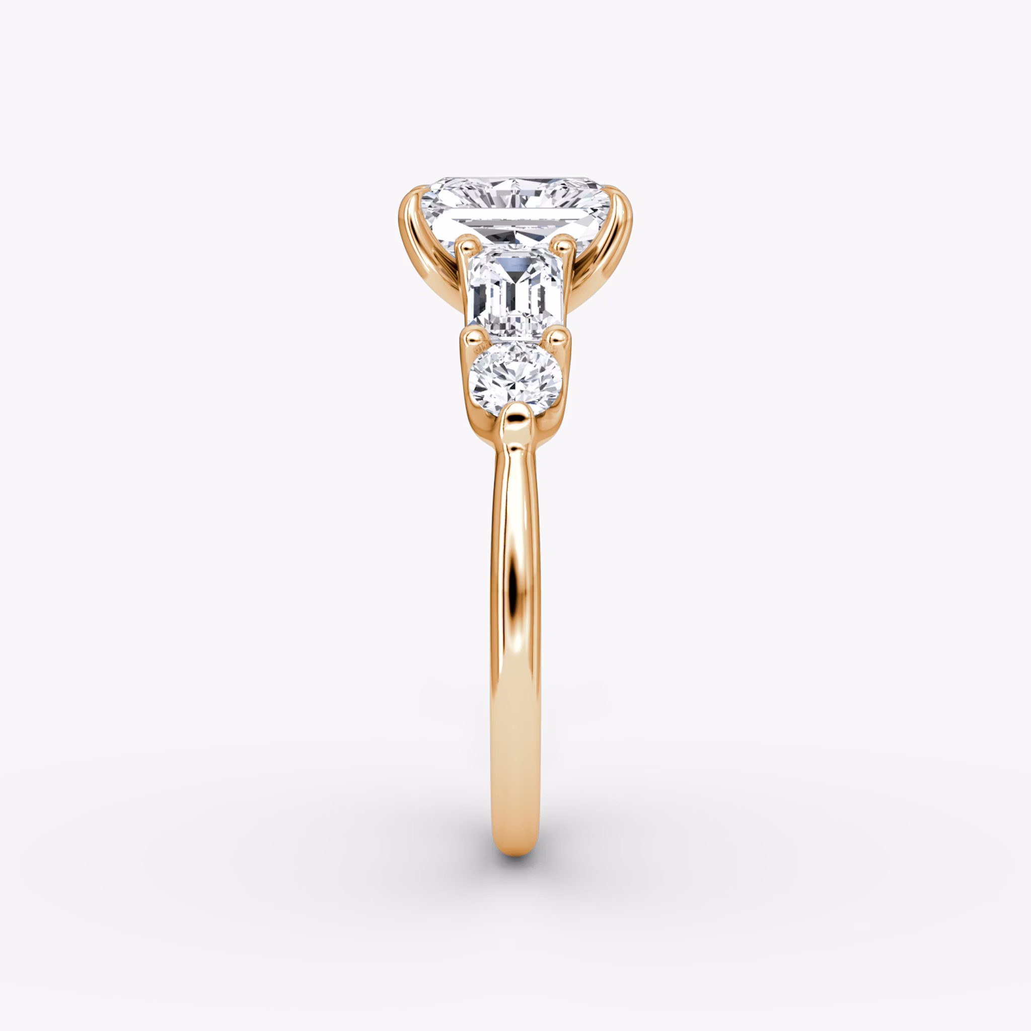 The Mixed Shape | Radiant | 14k | Rose Gold | bandAccent: Plain | sideStoneOrientation: horizontal | sideStoneShape: Emerald and Round Brilliant | diamondOrientation: vertical | caratWeight: other