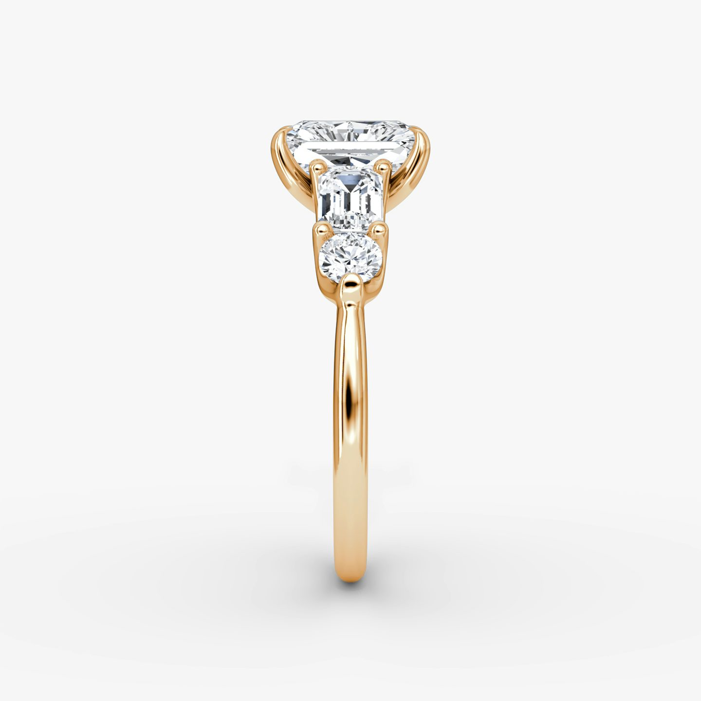 The Mixed Shape | Radiant | 14k | Rose Gold | bandAccent: Plain | sideStoneOrientation: horizontal | sideStoneShape: Emerald and Round Brilliant | diamondOrientation: vertical | caratWeight: other