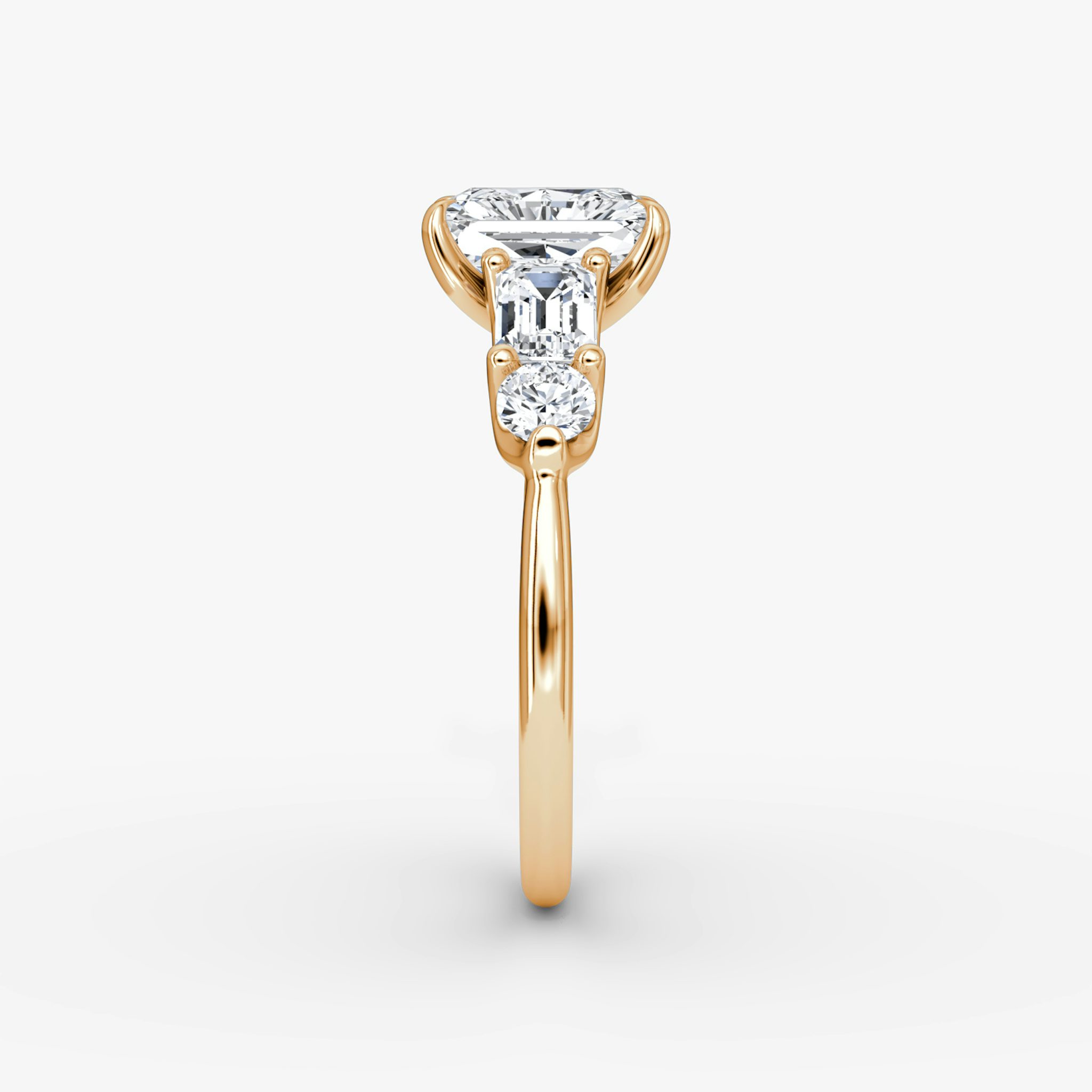The Mixed Shape | Radiant | 14k | Rose Gold | bandAccent: Plain | sideStoneOrientation: horizontal | sideStoneShape: Emerald and Round Brilliant | diamondOrientation: vertical | caratWeight: other