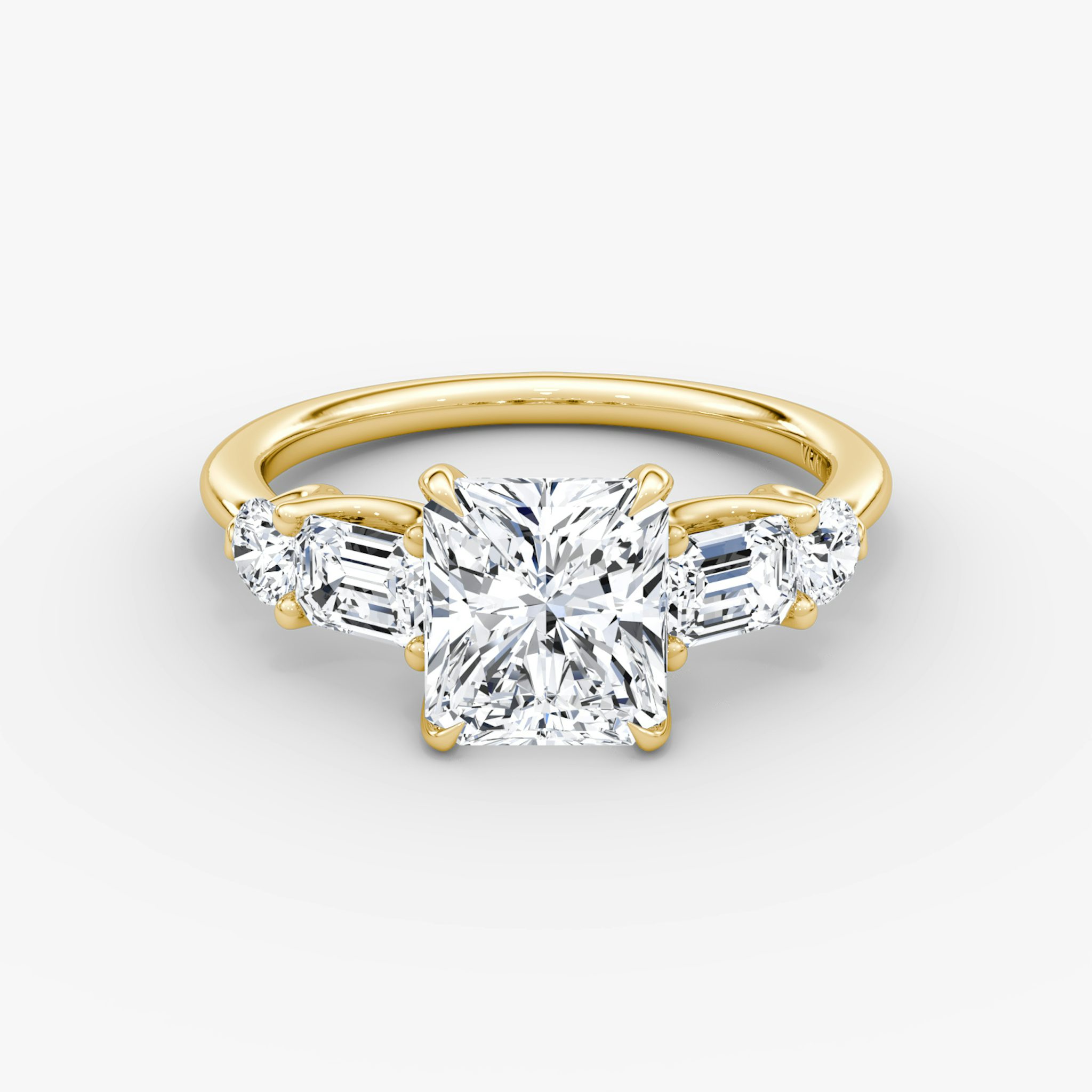 The Mixed Shape | Radiant | 18k | Yellow Gold | bandAccent: Plain | sideStoneOrientation: horizontal | sideStoneShape: Emerald and Round Brilliant | diamondOrientation: vertical | caratWeight: other