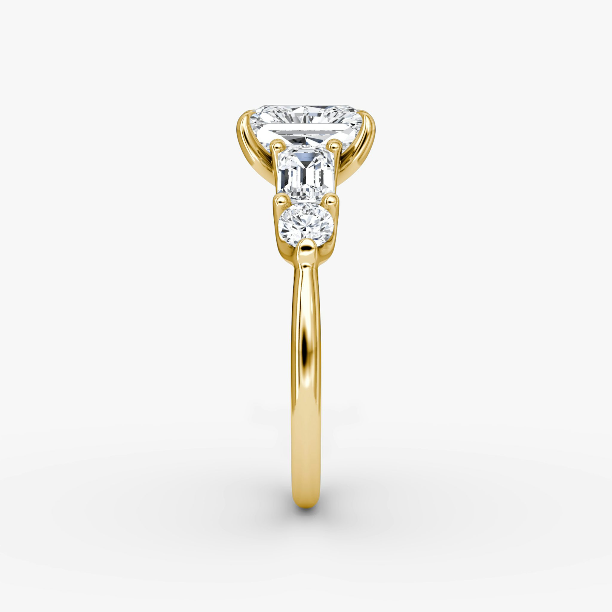 The Mixed Shape | Radiant | 18k | Yellow Gold | bandAccent: Plain | sideStoneOrientation: horizontal | sideStoneShape: Emerald and Round Brilliant | diamondOrientation: vertical | caratWeight: other