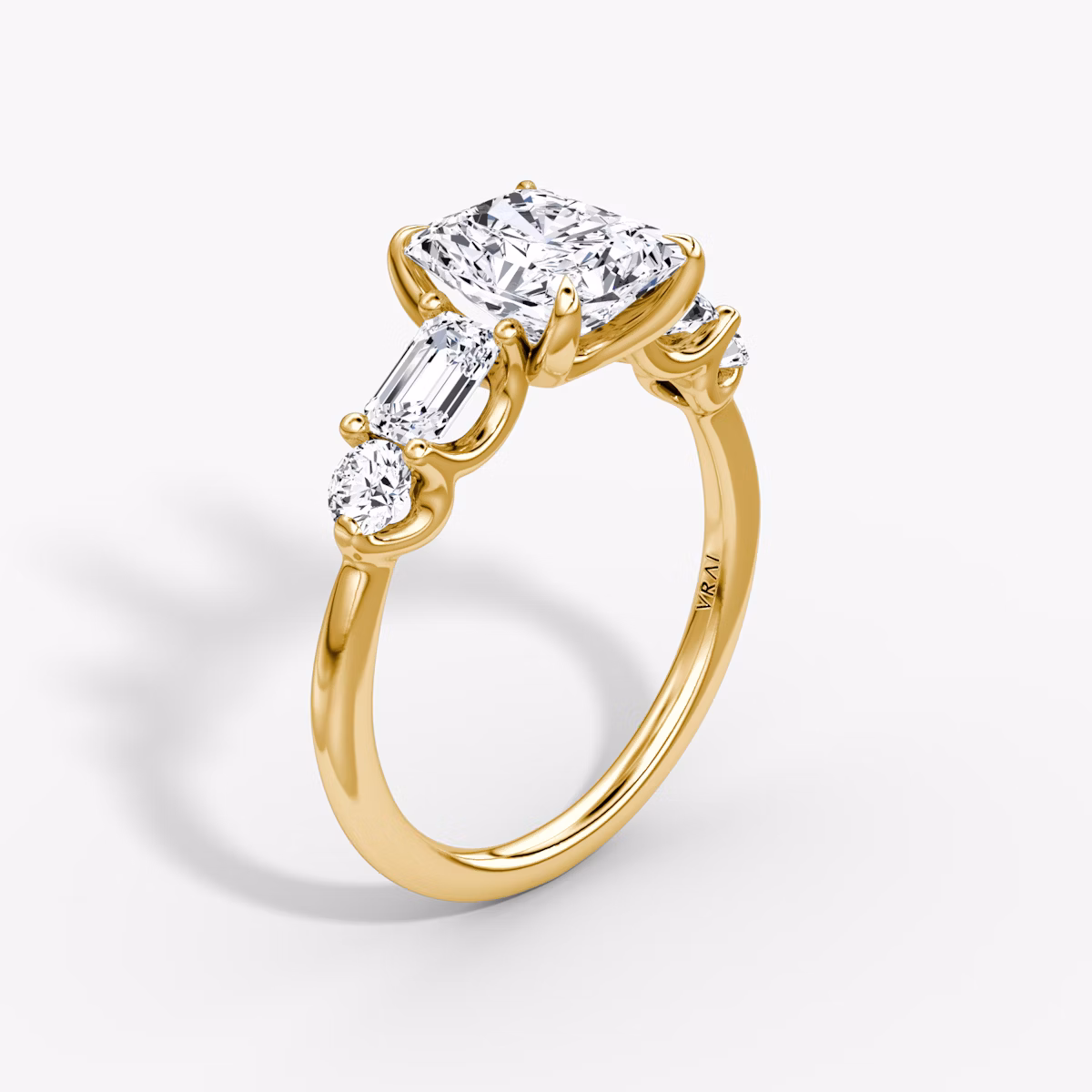 The Mixed Shape | Radiant | 18k | Yellow Gold | bandAccent: Plain | sideStoneOrientation: horizontal | sideStoneShape: Emerald and Round Brilliant | diamondOrientation: vertical | caratWeight: other