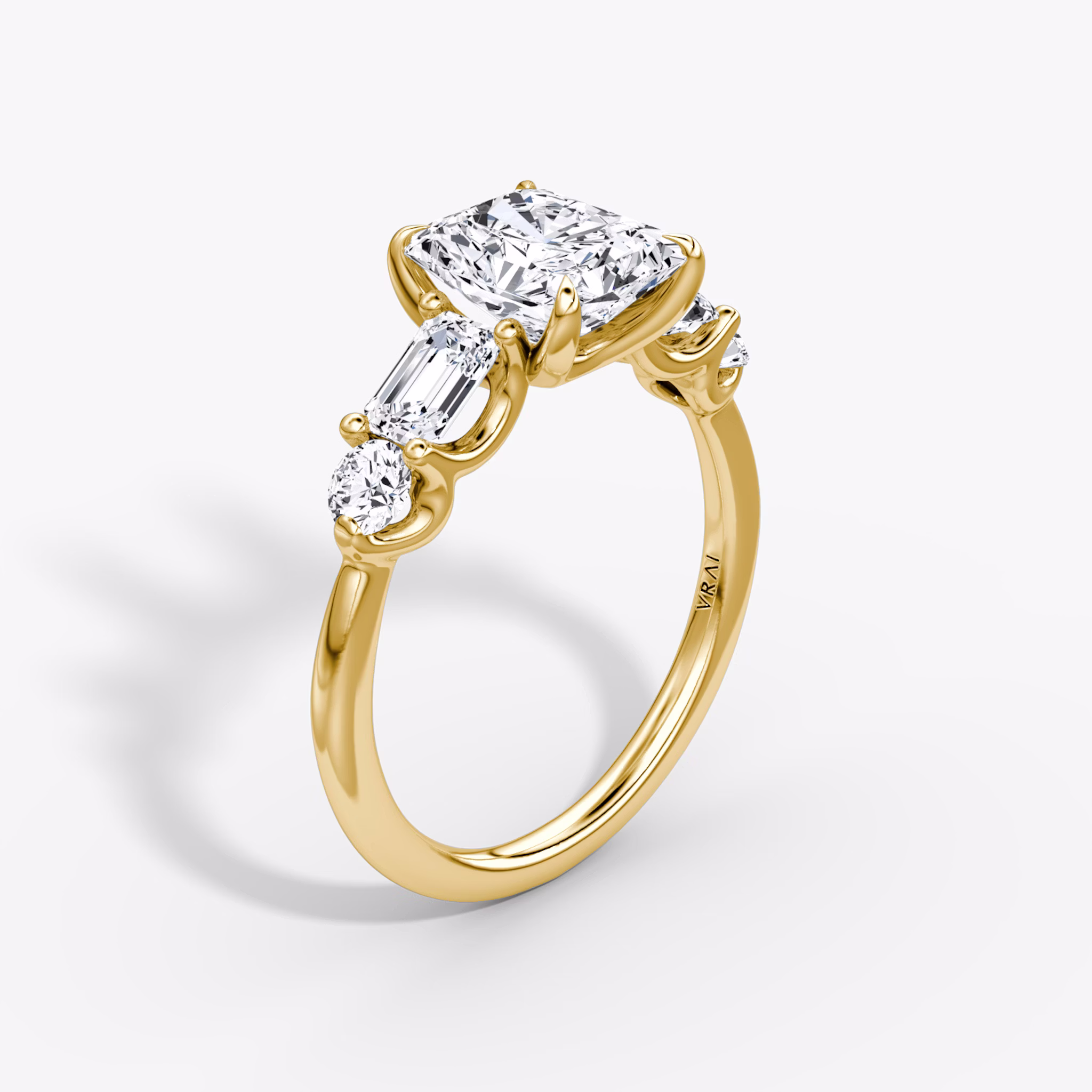 The Mixed Shape | Radiant | 18k | Yellow Gold | bandAccent: Plain | sideStoneOrientation: horizontal | sideStoneShape: Emerald and Round Brilliant | diamondOrientation: vertical | caratWeight: other