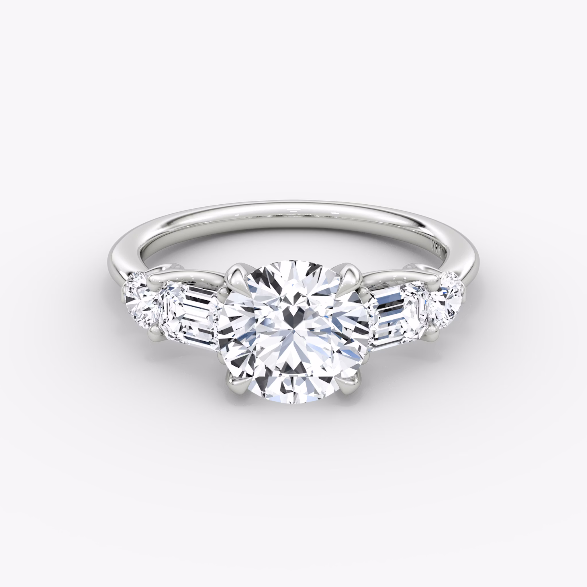 The Mixed Shape | Round Brilliant | 18k | White Gold | bandAccent: Plain | caratWeight: other | sideStoneOrientation: horizontal | sideStoneShape: Emerald and Round Brilliant | diamondOrientation: vertical