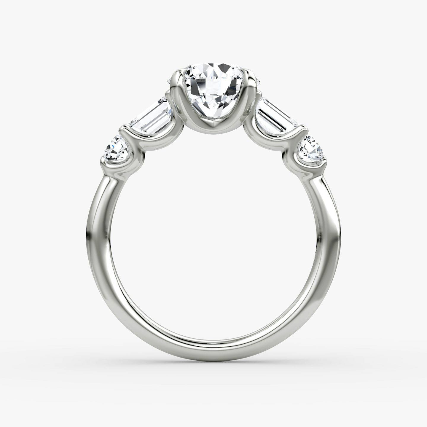 The Mixed Shape | Round Brilliant | Platinum | bandAccent: Plain | caratWeight: other | sideStoneOrientation: horizontal | sideStoneShape: Emerald and Round Brilliant | diamondOrientation: vertical