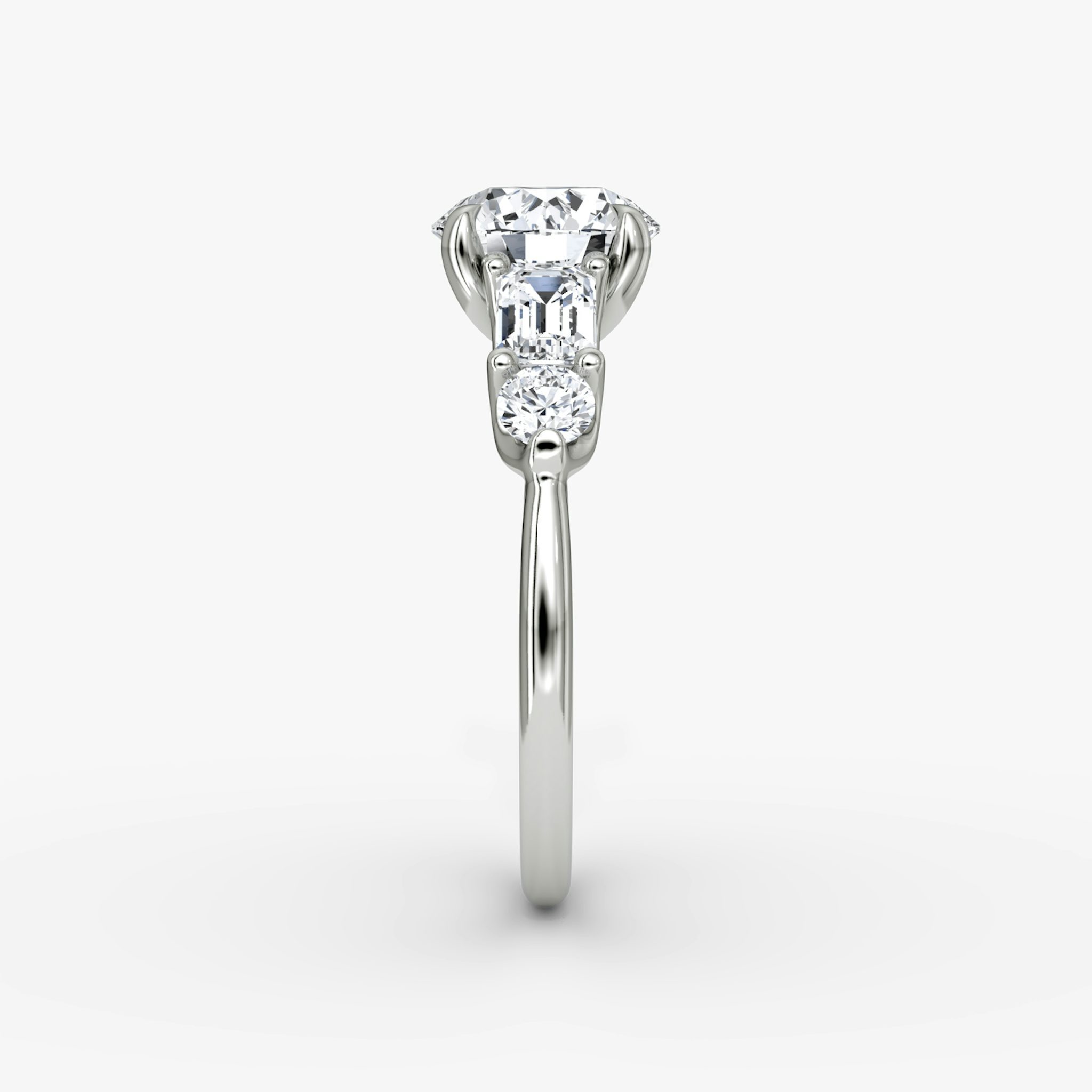 The Mixed Shape | Round Brilliant | 18k | White Gold | bandAccent: Plain | caratWeight: other | sideStoneOrientation: horizontal | sideStoneShape: Emerald and Round Brilliant | diamondOrientation: vertical