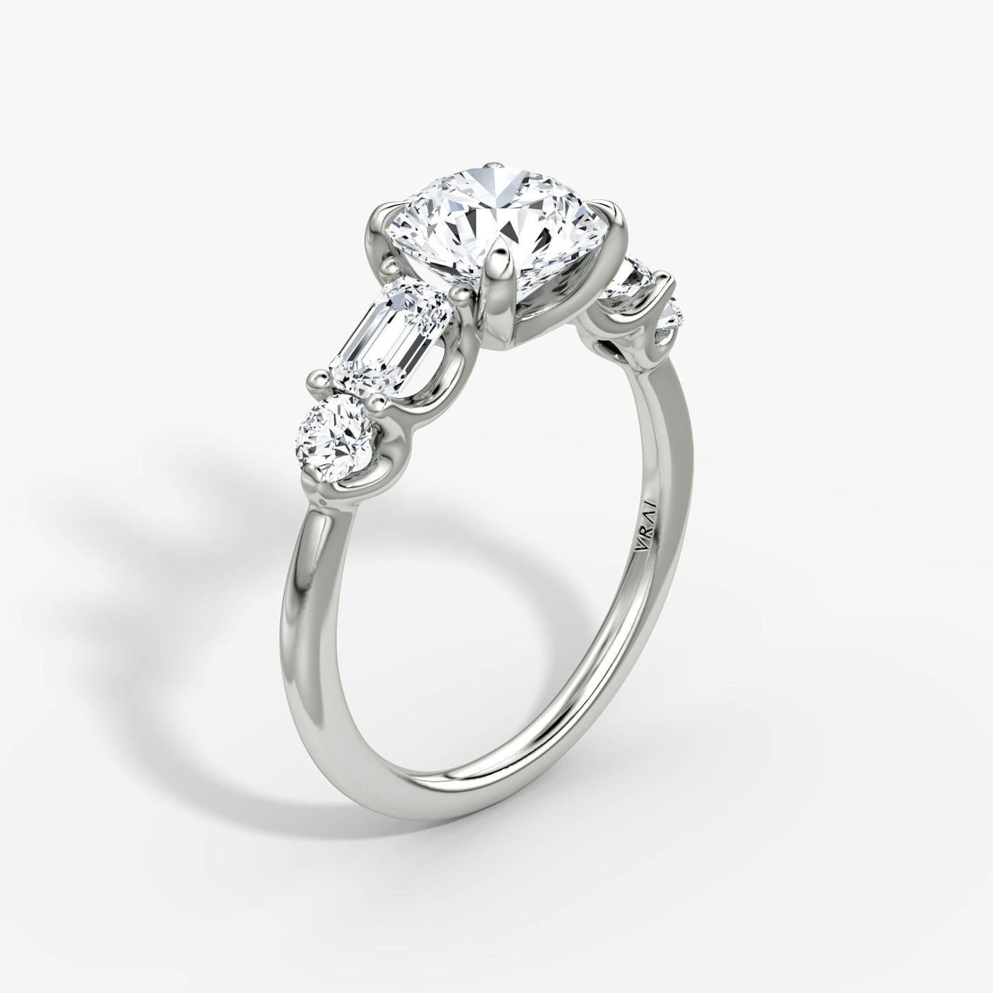 The Mixed Shape | Round Brilliant | Platinum | bandAccent: Plain | caratWeight: other | sideStoneOrientation: horizontal | sideStoneShape: Emerald and Round Brilliant | diamondOrientation: vertical