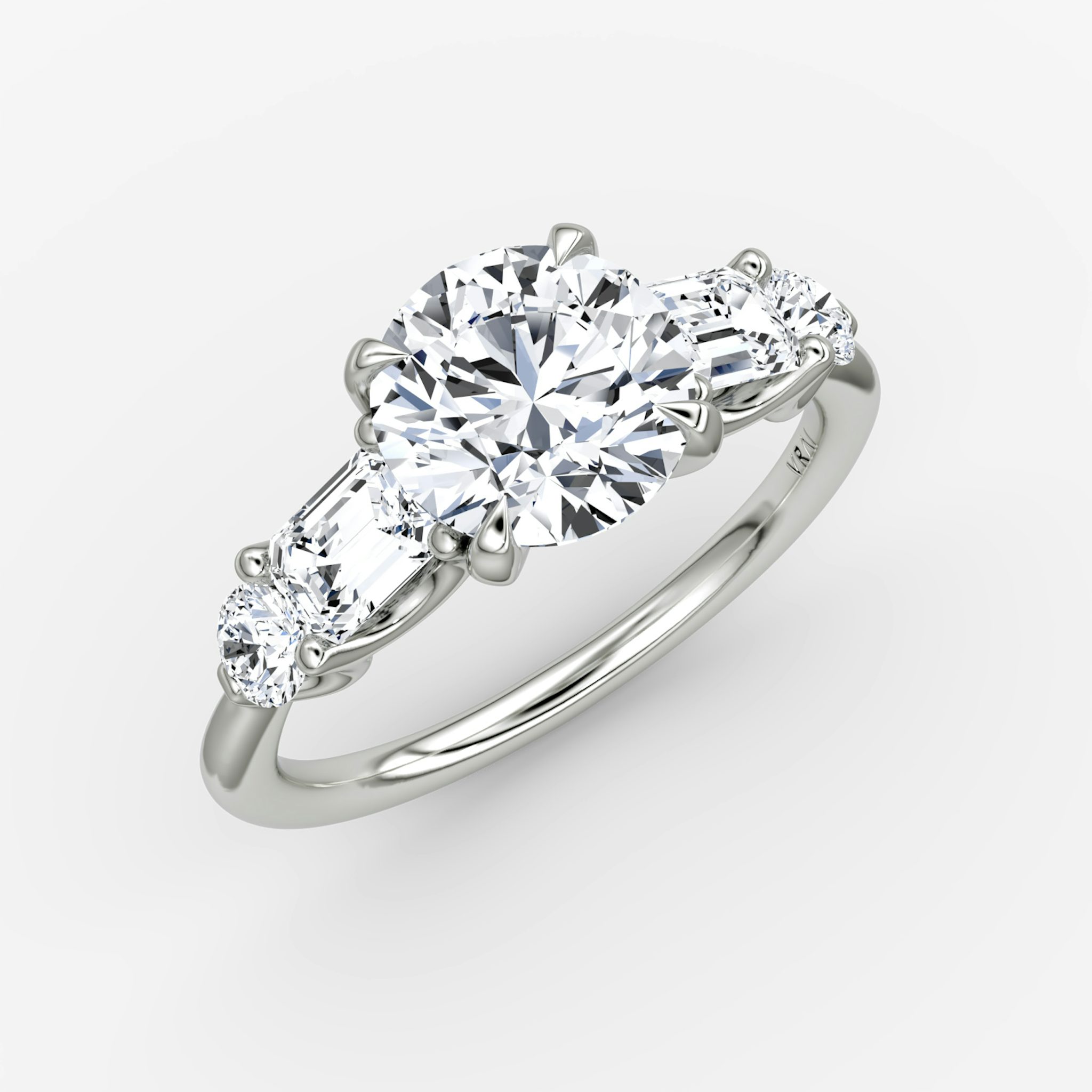 The Mixed Shape | Round Brilliant | 18k | White Gold | bandAccent: Plain | caratWeight: other | sideStoneOrientation: horizontal | sideStoneShape: Emerald and Round Brilliant | diamondOrientation: vertical