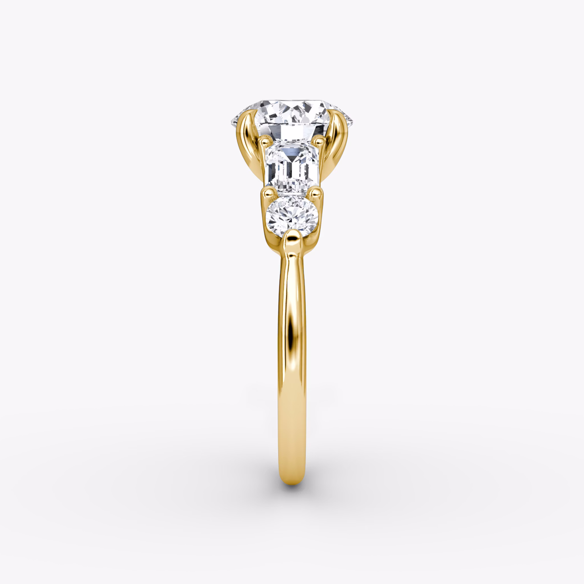 The Mixed Shape | Round Brilliant | 18k | Yellow Gold | bandAccent: Plain | caratWeight: other | sideStoneOrientation: horizontal | sideStoneShape: Emerald and Round Brilliant | diamondOrientation: vertical