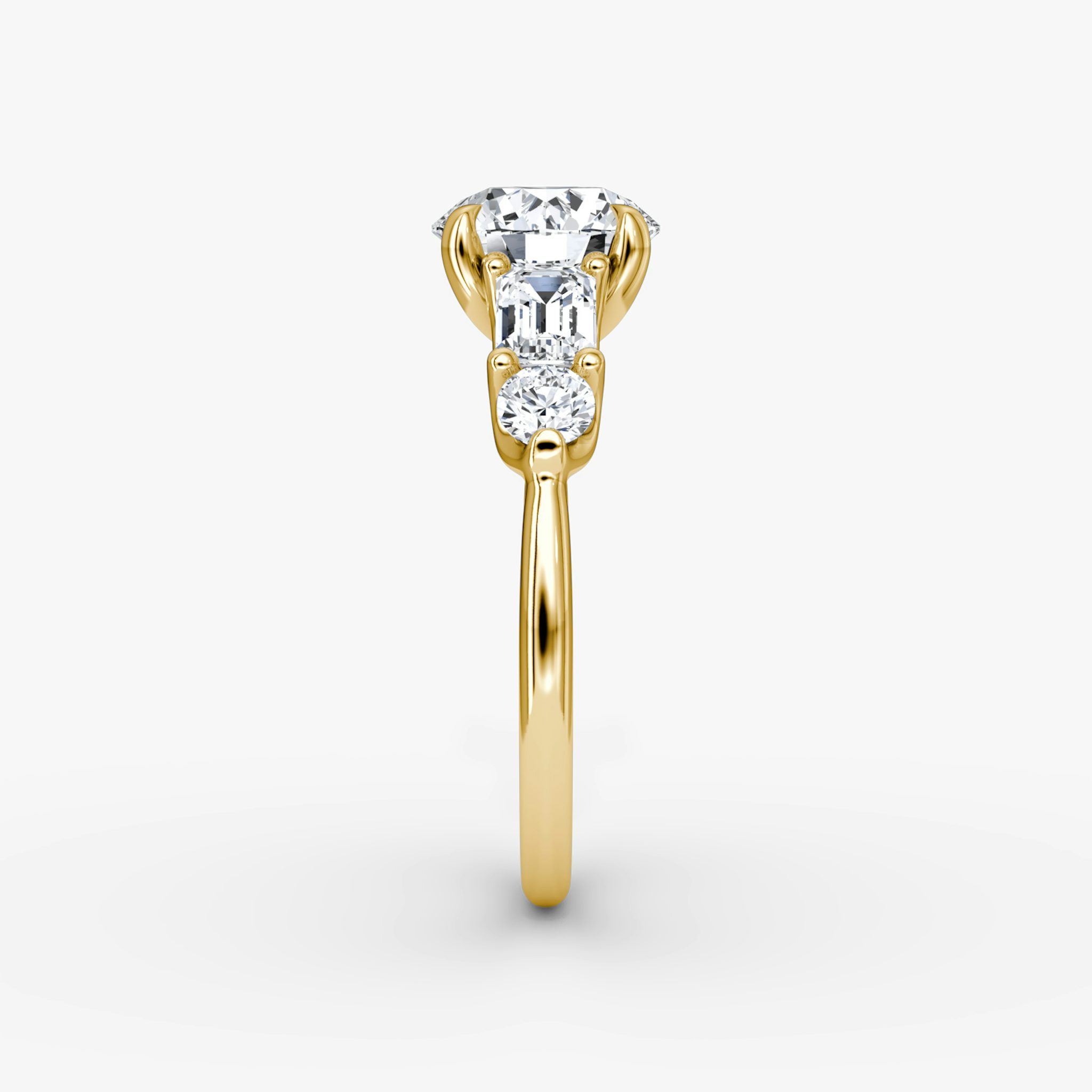 The Mixed Shape | Round Brilliant | 18k | Yellow Gold | bandAccent: Plain | caratWeight: other | sideStoneOrientation: horizontal | sideStoneShape: Emerald and Round Brilliant | diamondOrientation: vertical