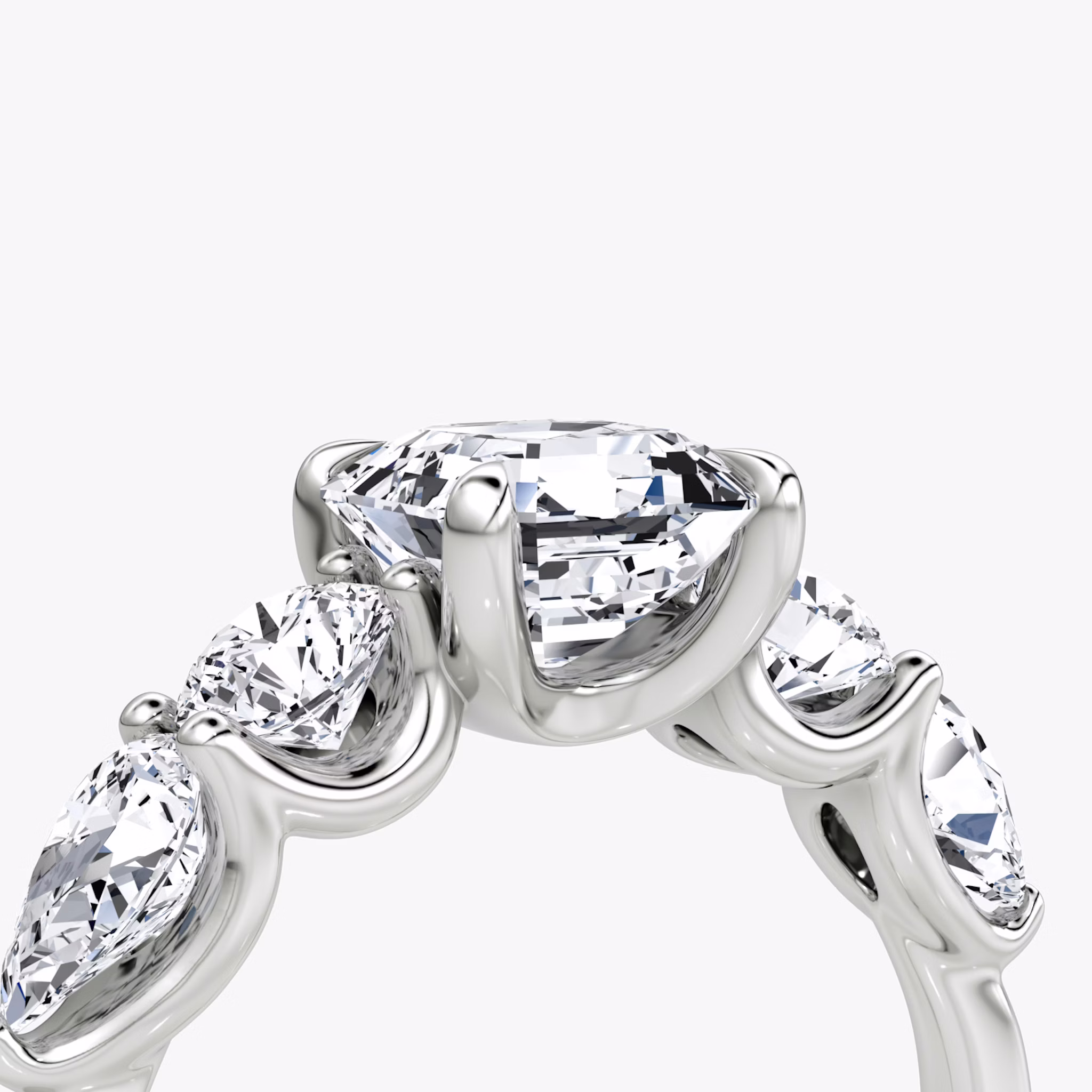 The Mixed Shape | Asscher | 18k | White Gold | bandAccent: Plain | sideStoneOrientation: horizontal | sideStoneShape: Round Brilliant and Pear | diamondOrientation: vertical | caratWeight: other