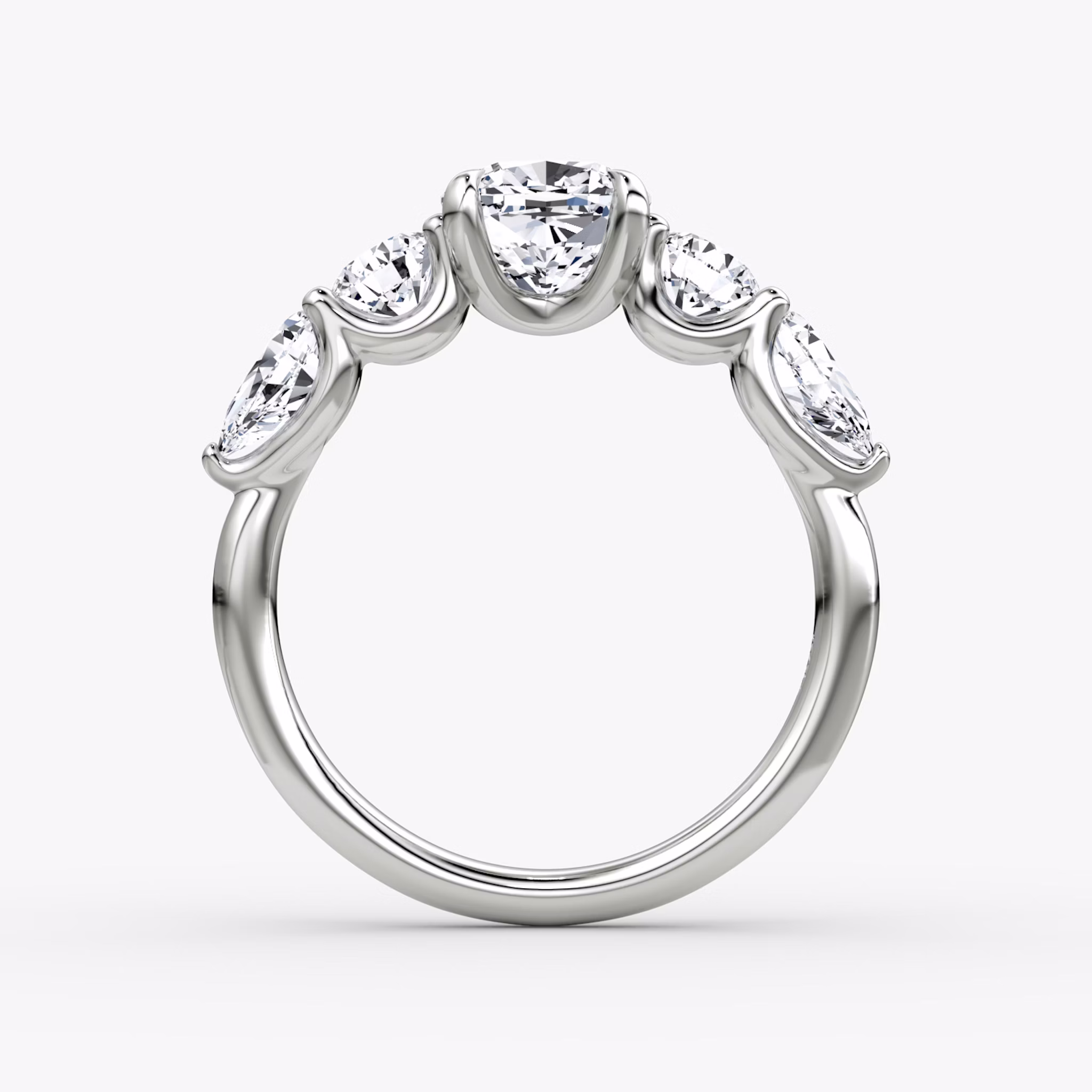 The Mixed Shape | Cushion | 18k | White Gold | bandAccent: Plain | sideStoneOrientation: horizontal | sideStoneShape: Round Brilliant and Pear | diamondOrientation: vertical | caratWeight: other