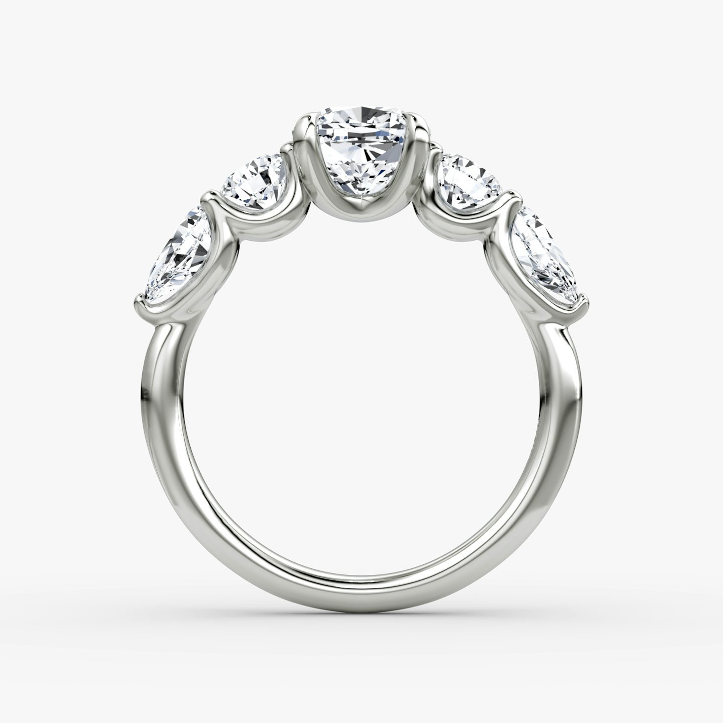 The Mixed Shape | Cushion | Platinum | bandAccent: Plain | sideStoneOrientation: horizontal | sideStoneShape: Round Brilliant and Pear | diamondOrientation: vertical | caratWeight: other