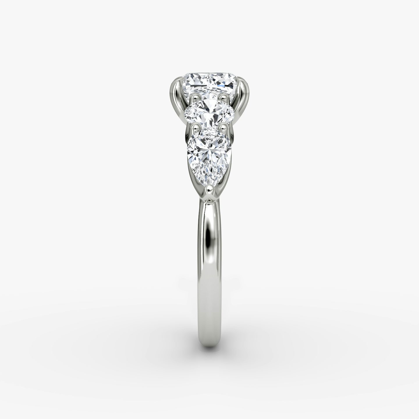 The Mixed Shape | Cushion | Platinum | bandAccent: Plain | sideStoneOrientation: horizontal | sideStoneShape: Round Brilliant and Pear | diamondOrientation: vertical | caratWeight: other