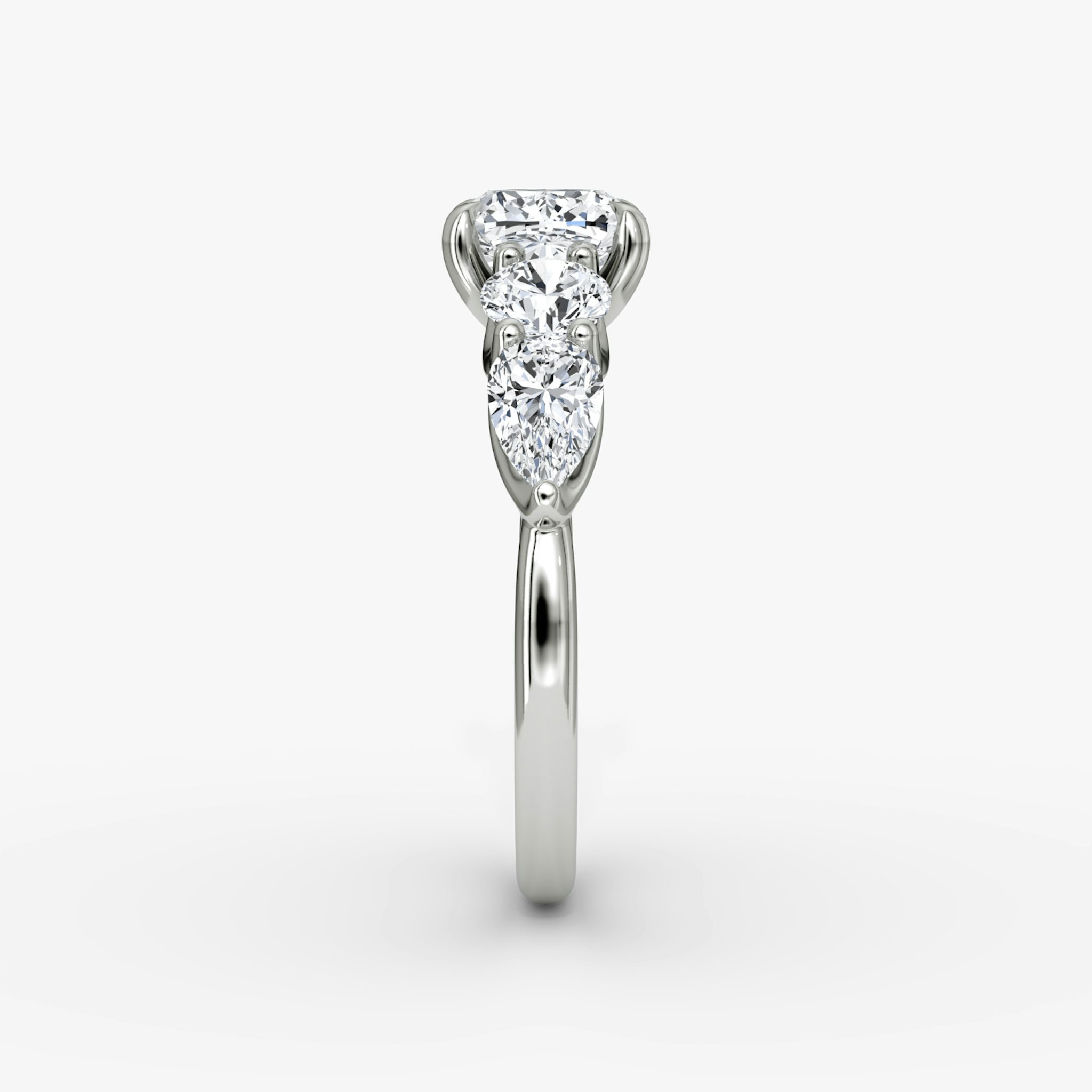 The Mixed Shape | Cushion | 18k | White Gold | bandAccent: Plain | sideStoneOrientation: horizontal | sideStoneShape: Round Brilliant and Pear | diamondOrientation: vertical | caratWeight: other