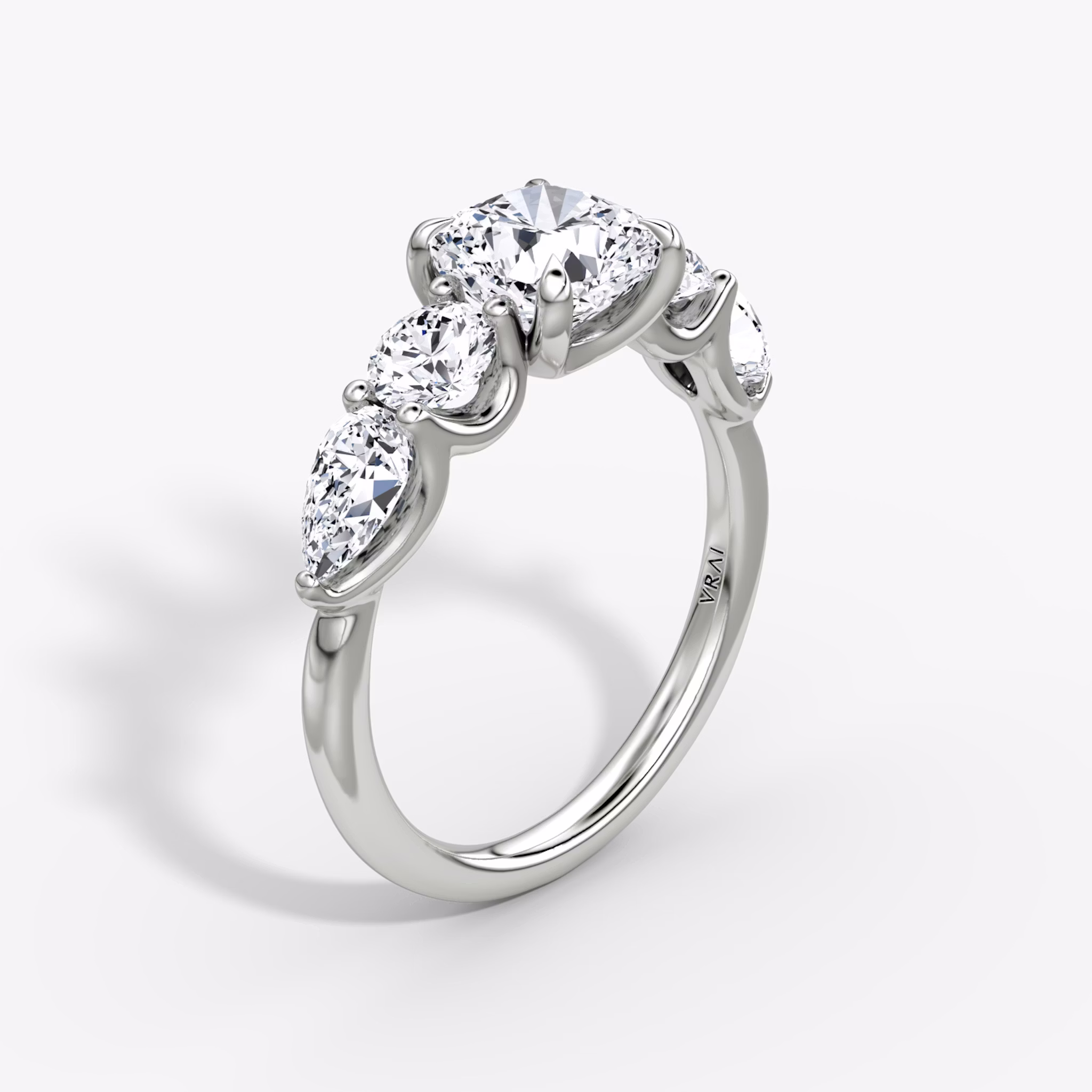 The Mixed Shape | Cushion | 18k | White Gold | bandAccent: Plain | sideStoneOrientation: horizontal | sideStoneShape: Round Brilliant and Pear | diamondOrientation: vertical | caratWeight: other