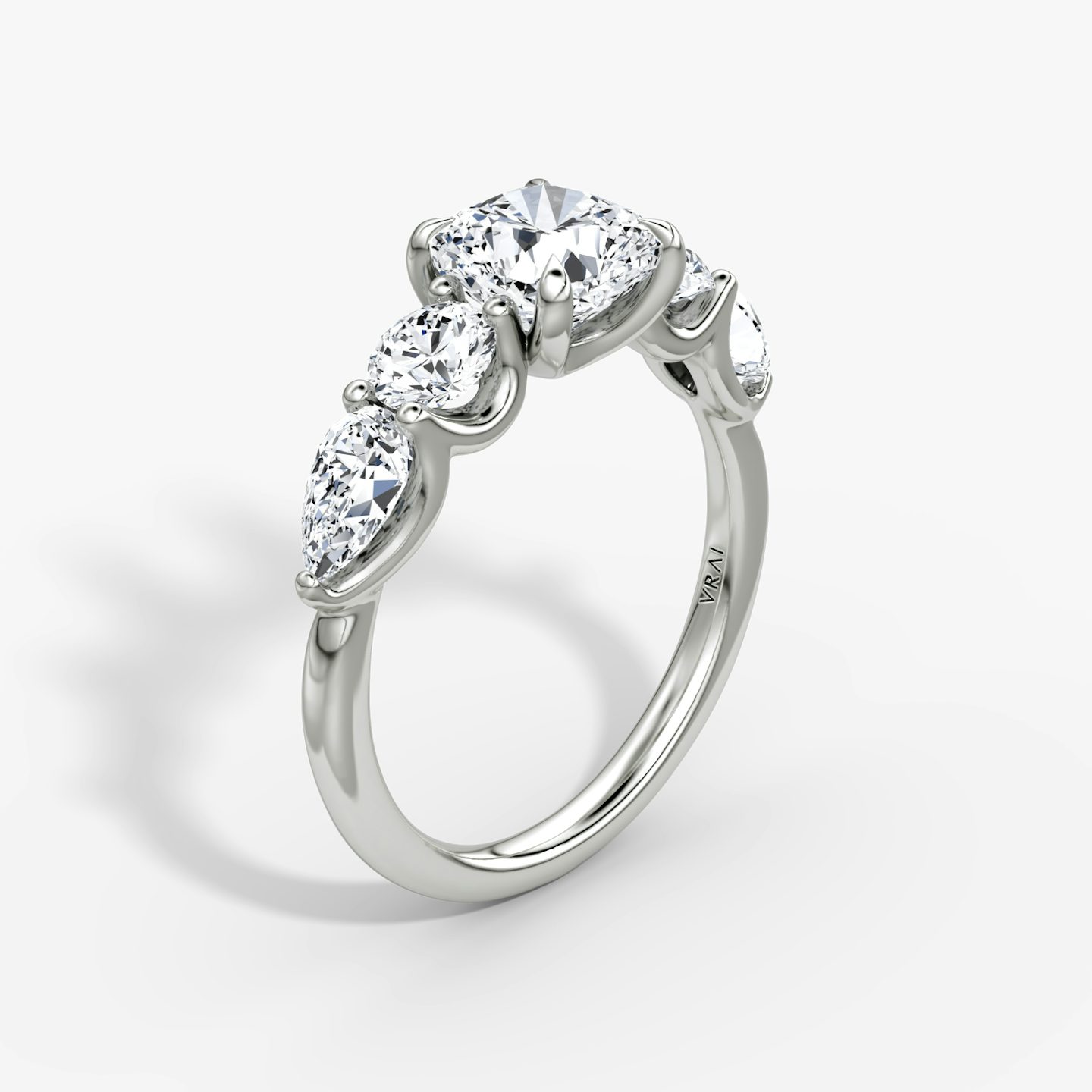 The Mixed Shape | Cushion | Platinum | bandAccent: Plain | sideStoneOrientation: horizontal | sideStoneShape: Round Brilliant and Pear | diamondOrientation: vertical | caratWeight: other