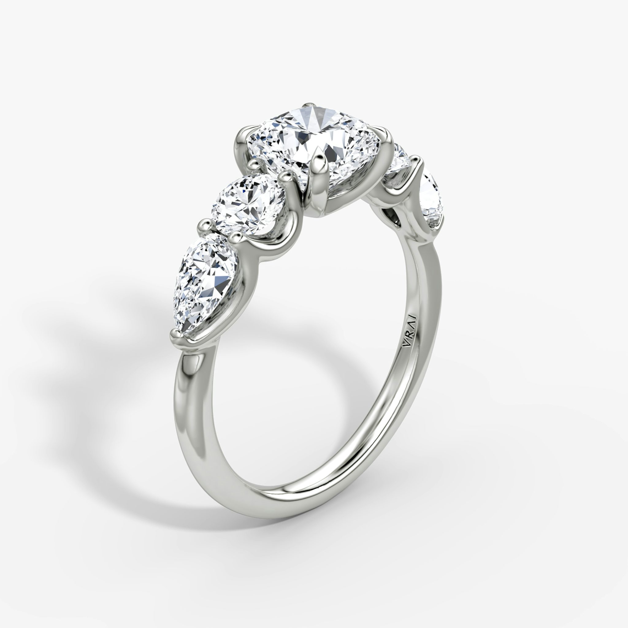 The Mixed Shape | Cushion | 18k | White Gold | bandAccent: Plain | sideStoneOrientation: horizontal | sideStoneShape: Round Brilliant and Pear | diamondOrientation: vertical | caratWeight: other