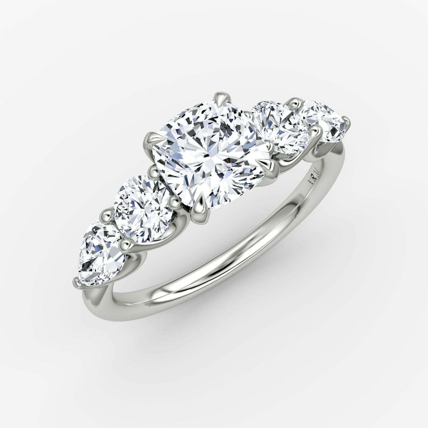The Mixed Shape | Cushion | Platinum | bandAccent: Plain | sideStoneOrientation: horizontal | sideStoneShape: Round Brilliant and Pear | diamondOrientation: vertical | caratWeight: other