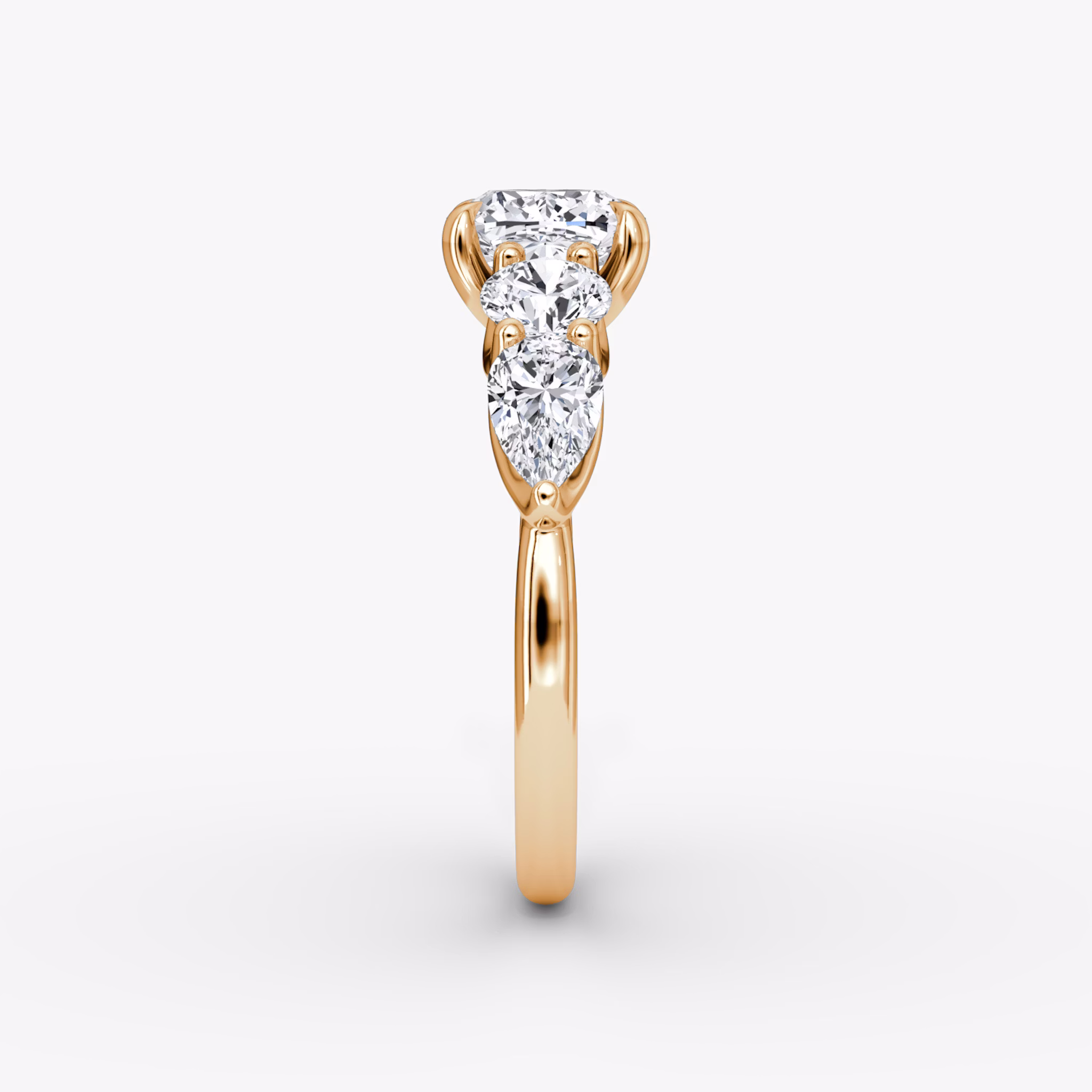 The Mixed Shape | Cushion | 14k | Rose Gold | bandAccent: Plain | sideStoneOrientation: horizontal | sideStoneShape: Round Brilliant and Pear | diamondOrientation: vertical | caratWeight: other