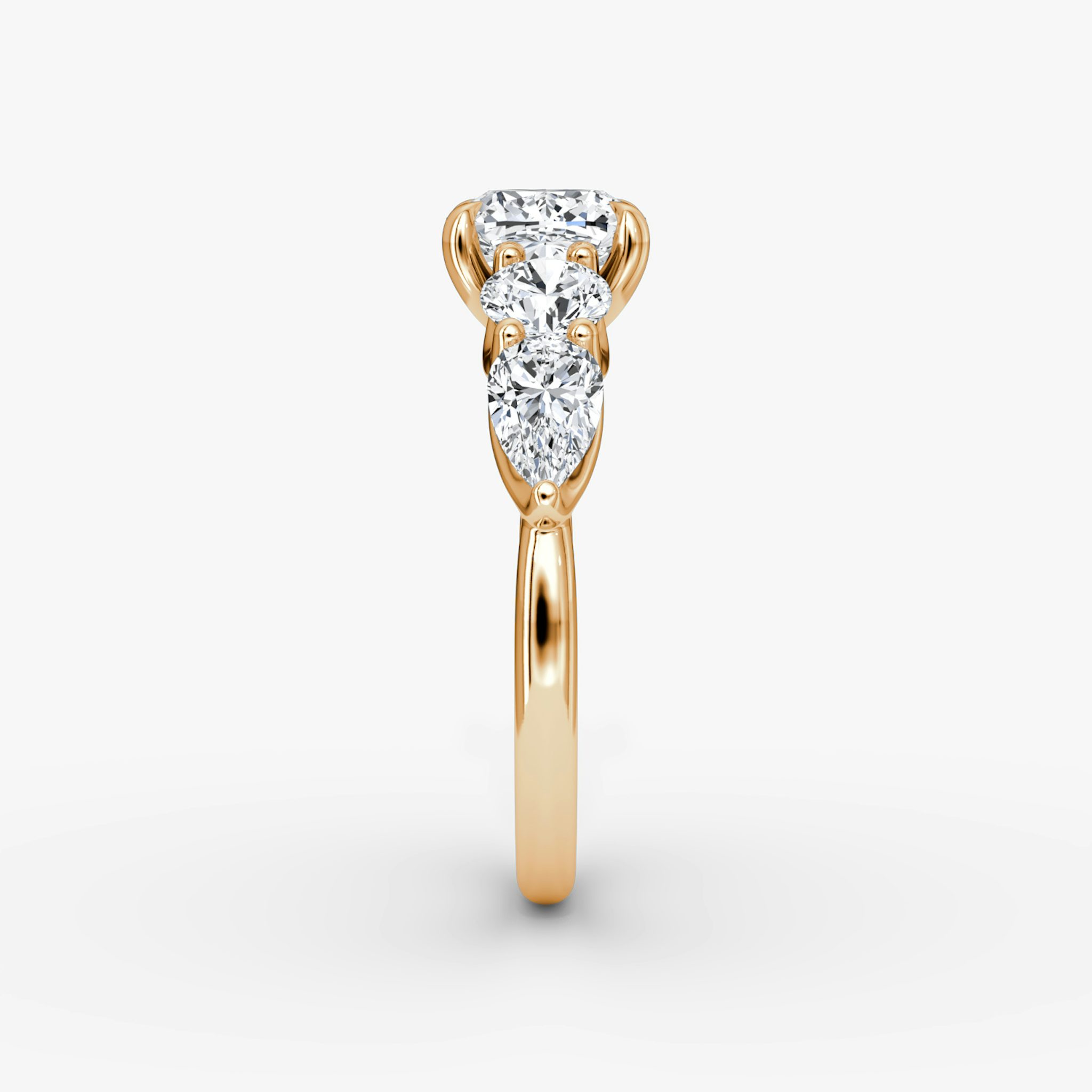 The Mixed Shape | Cushion | 14k | Rose Gold | bandAccent: Plain | sideStoneOrientation: horizontal | sideStoneShape: Round Brilliant and Pear | diamondOrientation: vertical | caratWeight: other