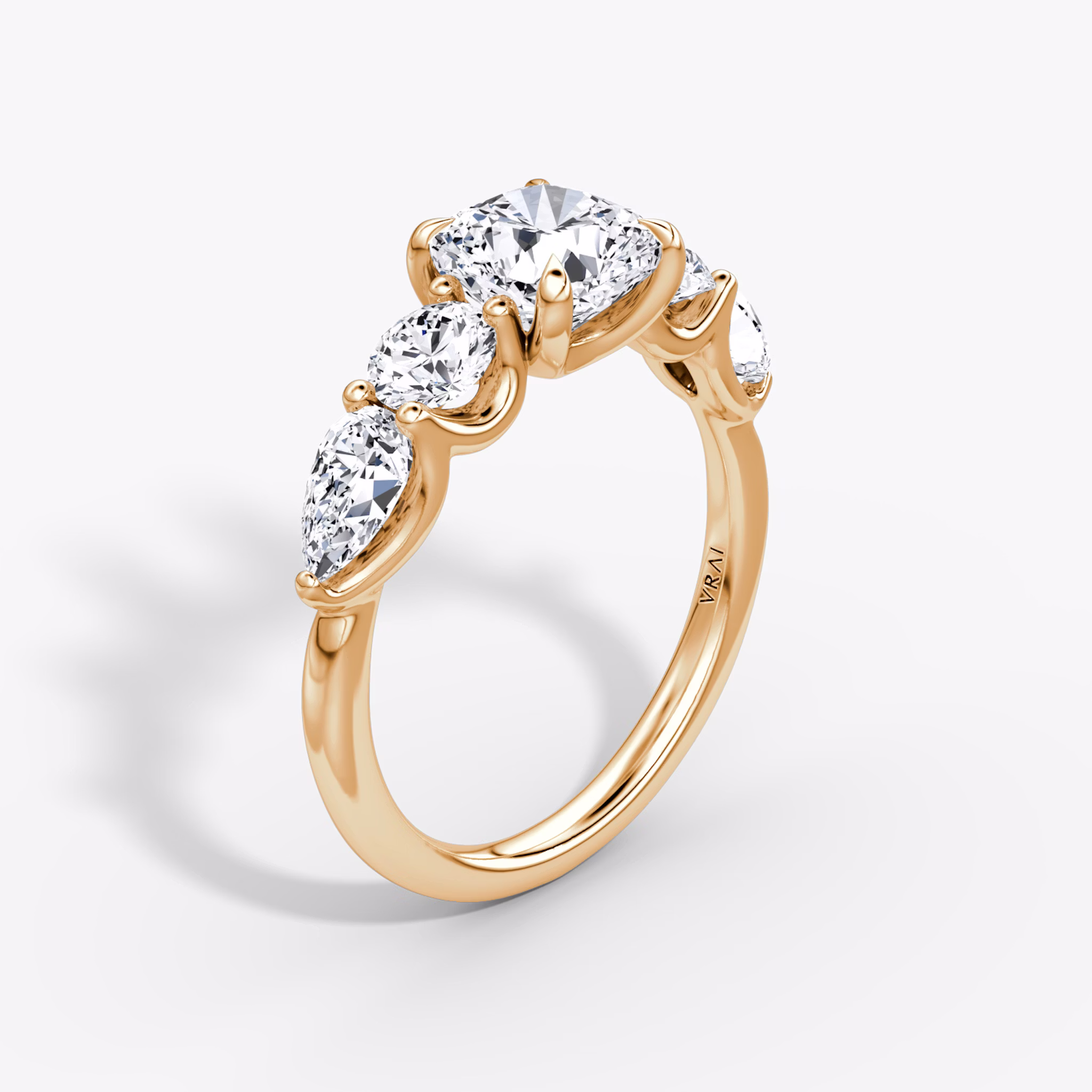 The Mixed Shape | Cushion | 14k | Rose Gold | bandAccent: Plain | sideStoneOrientation: horizontal | sideStoneShape: Round Brilliant and Pear | diamondOrientation: vertical | caratWeight: other