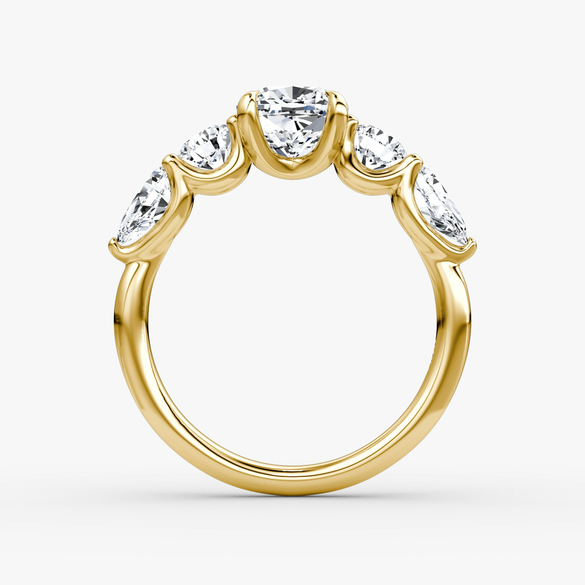 The Mixed Shape | Cushion | 18k | Yellow Gold | bandAccent: Plain | sideStoneOrientation: horizontal | sideStoneShape: Round Brilliant and Pear | diamondOrientation: vertical | caratWeight: other