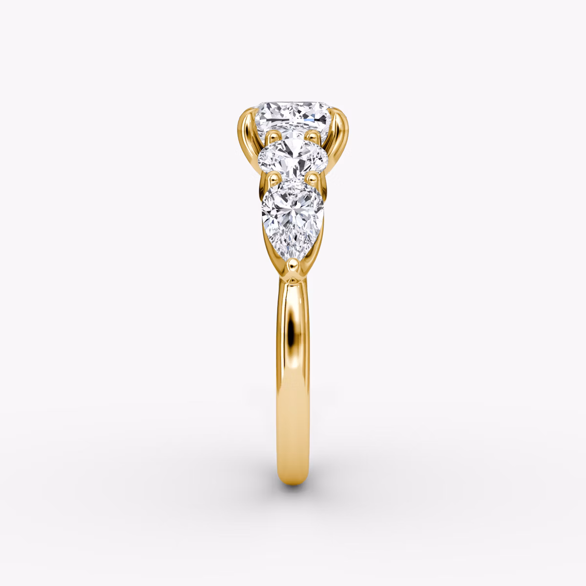 The Mixed Shape | Cushion | 18k | Yellow Gold | bandAccent: Plain | sideStoneOrientation: horizontal | sideStoneShape: Round Brilliant and Pear | diamondOrientation: vertical | caratWeight: other