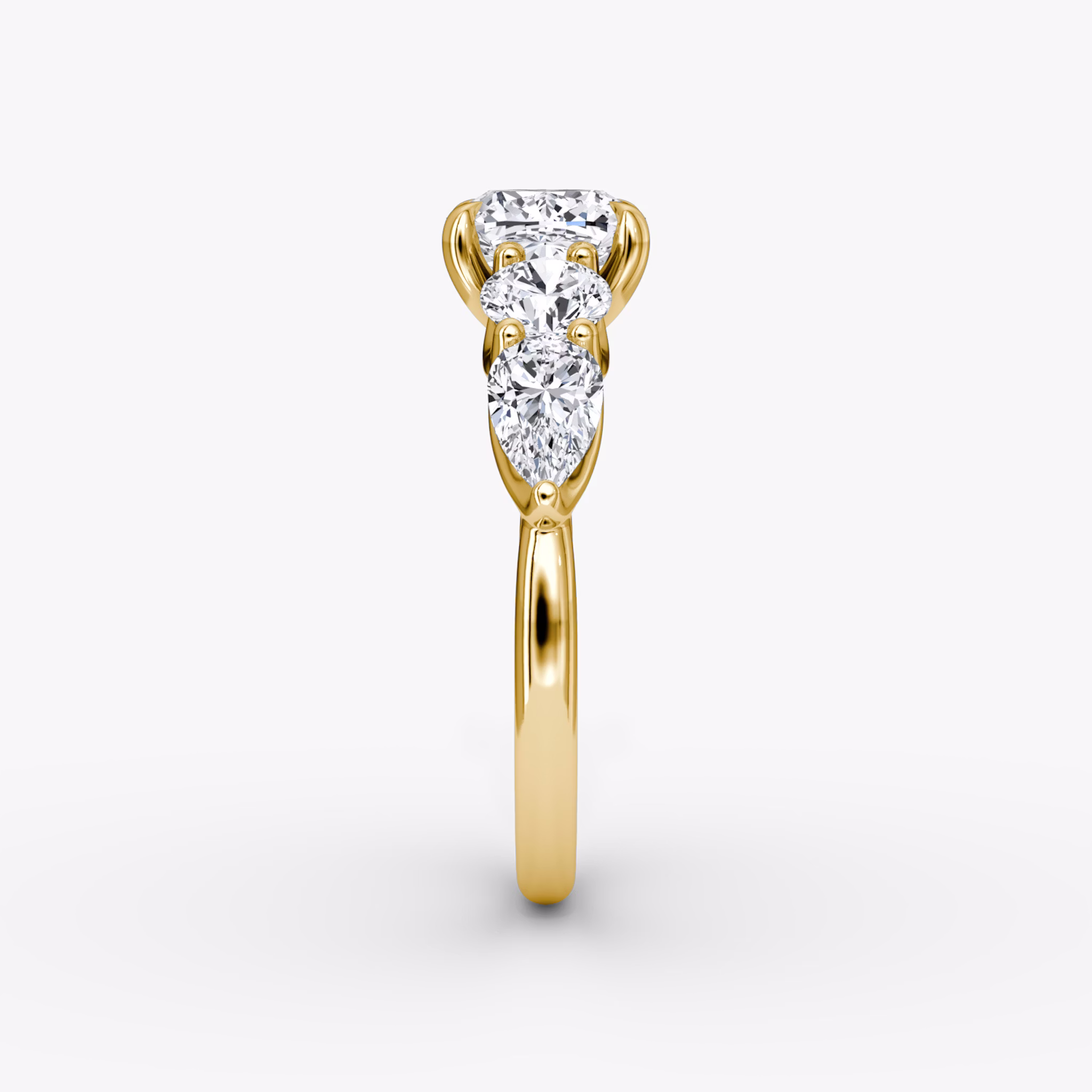 The Mixed Shape | Cushion | 18k | Yellow Gold | bandAccent: Plain | sideStoneOrientation: horizontal | sideStoneShape: Round Brilliant and Pear | diamondOrientation: vertical | caratWeight: other