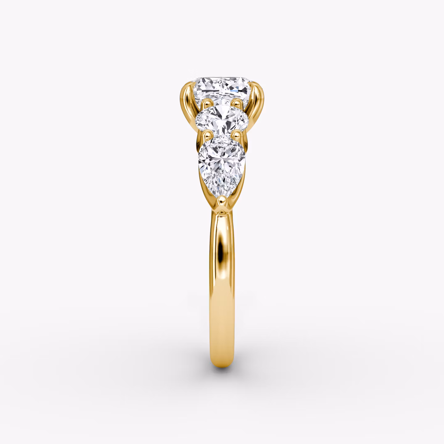 The Mixed Shape | Cushion | 18k | Yellow Gold | bandAccent: Plain | sideStoneOrientation: horizontal | sideStoneShape: Round Brilliant and Pear | diamondOrientation: vertical | caratWeight: other