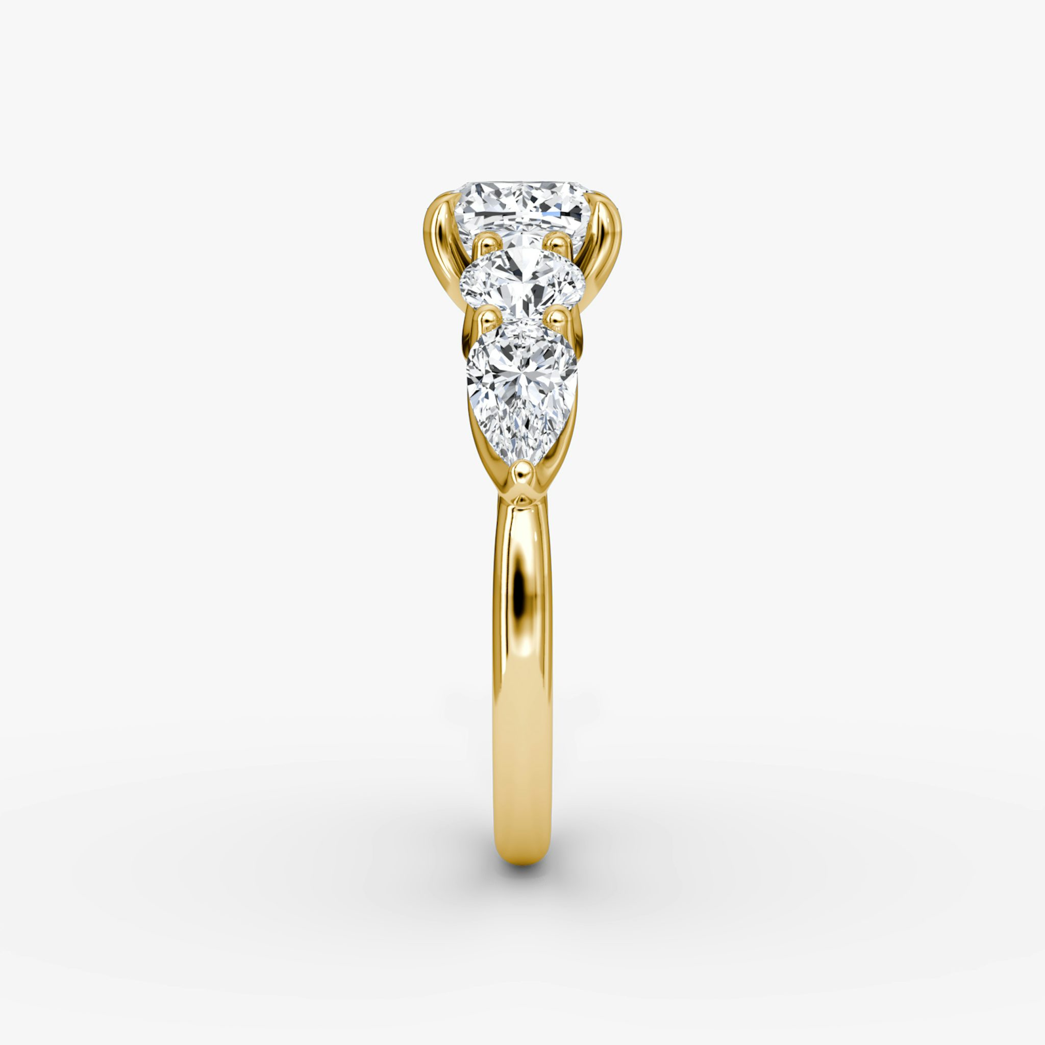 The Mixed Shape | Cushion | 18k | Yellow Gold | bandAccent: Plain | sideStoneOrientation: horizontal | sideStoneShape: Round Brilliant and Pear | diamondOrientation: vertical | caratWeight: other