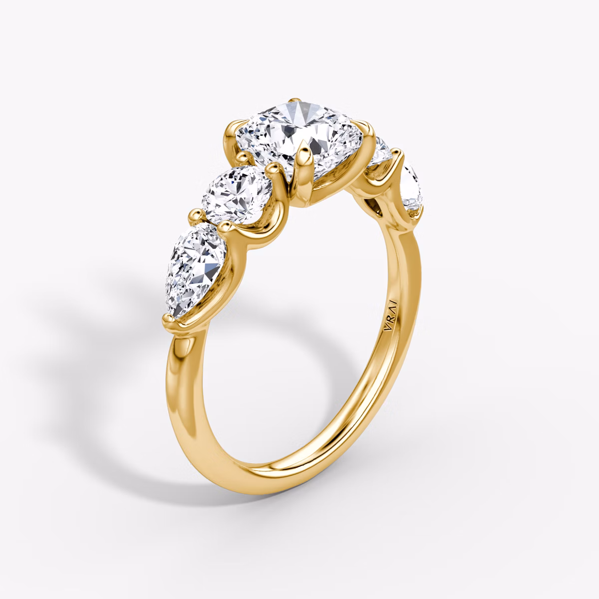 The Mixed Shape | Cushion | 18k | Yellow Gold | bandAccent: Plain | sideStoneOrientation: horizontal | sideStoneShape: Round Brilliant and Pear | diamondOrientation: vertical | caratWeight: other