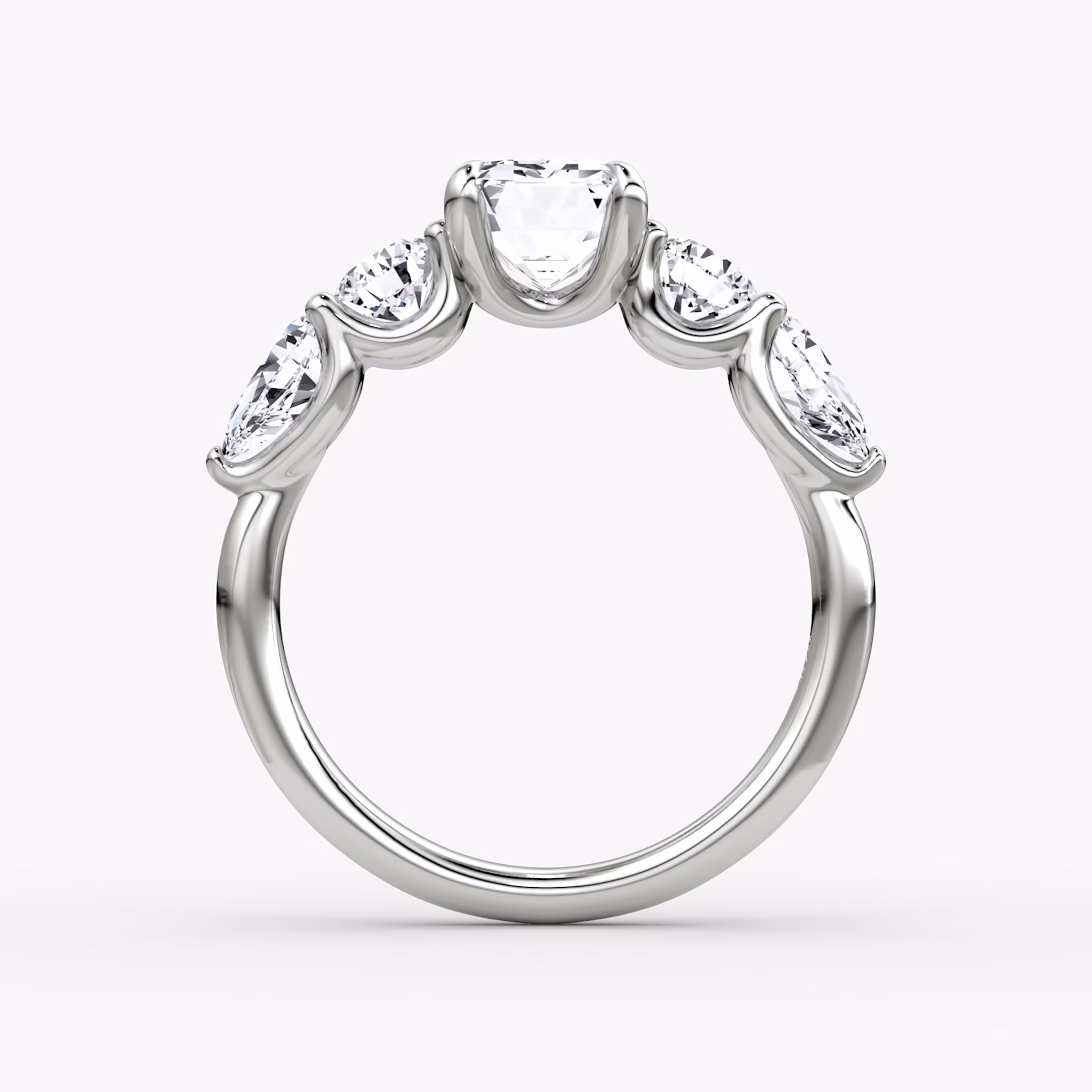 The Mixed Shape | Emerald | 18k | White Gold | bandAccent: Plain | sideStoneOrientation: horizontal | sideStoneShape: Round Brilliant and Pear | diamondOrientation: vertical | caratWeight: other