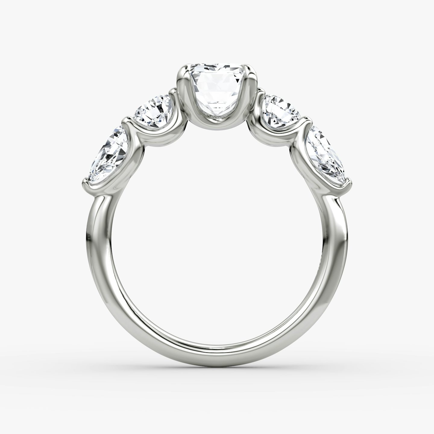 The Mixed Shape | Emerald | Platinum | bandAccent: Plain | sideStoneOrientation: horizontal | sideStoneShape: Round Brilliant and Pear | diamondOrientation: vertical | caratWeight: other