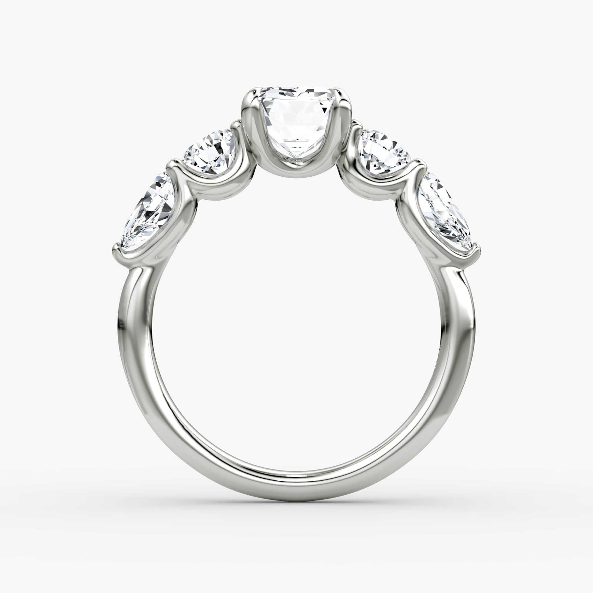 The Mixed Shape | Emerald | 18k | White Gold | bandAccent: Plain | sideStoneOrientation: horizontal | sideStoneShape: Round Brilliant and Pear | diamondOrientation: vertical | caratWeight: other