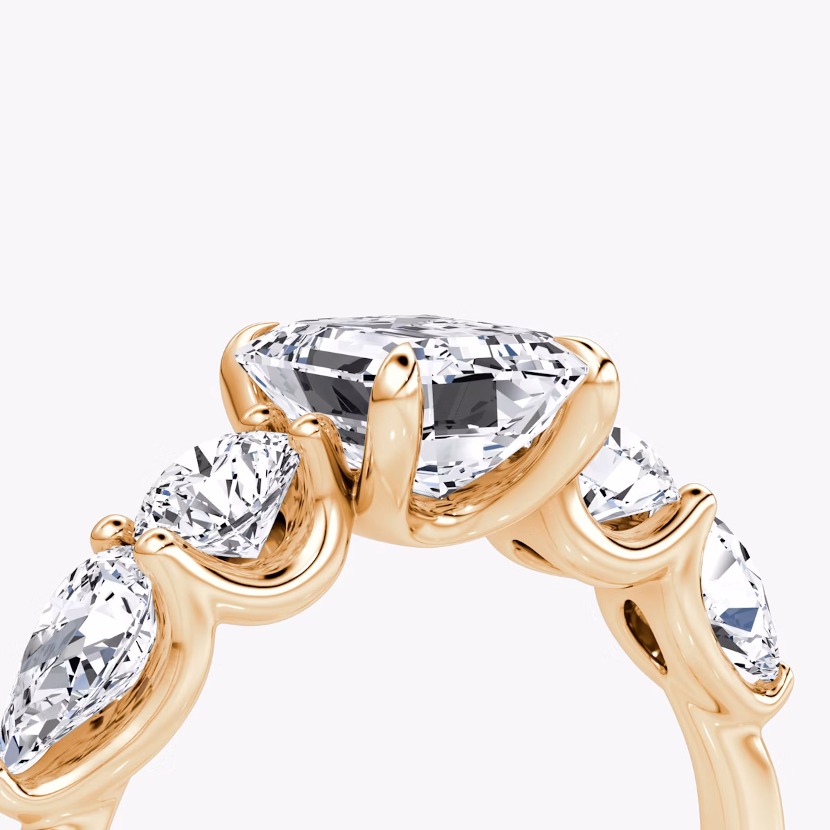 The Mixed Shape | Emerald | 14k | Rose Gold | bandAccent: Plain | sideStoneOrientation: horizontal | sideStoneShape: Round Brilliant and Pear | diamondOrientation: vertical | caratWeight: other