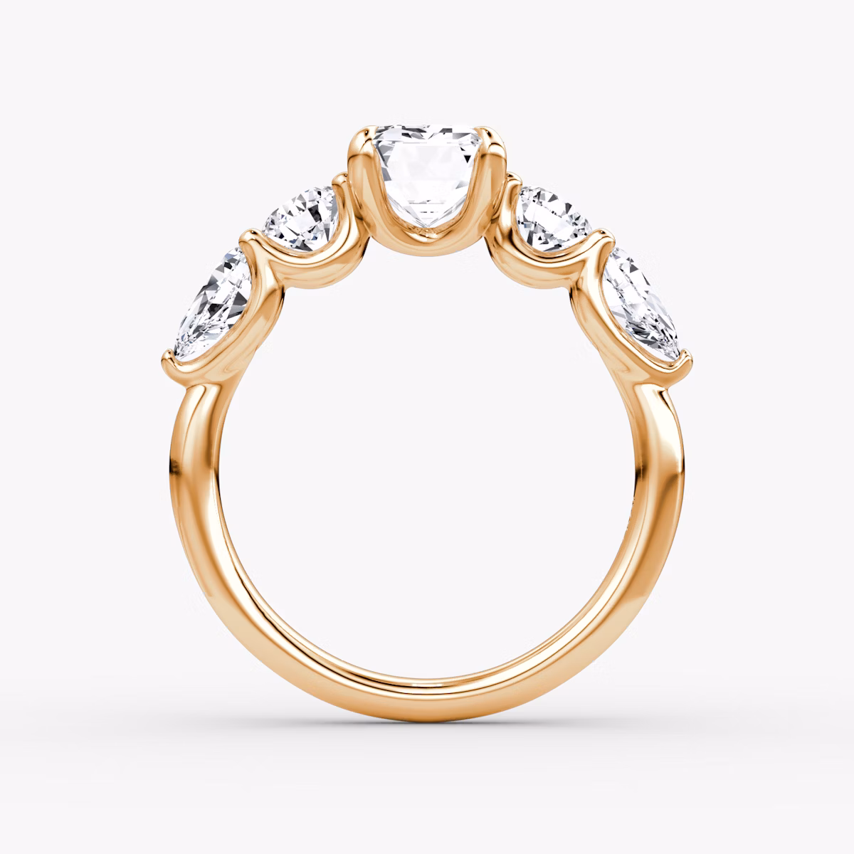 The Mixed Shape | Emerald | 14k | Rose Gold | bandAccent: Plain | sideStoneOrientation: horizontal | sideStoneShape: Round Brilliant and Pear | diamondOrientation: vertical | caratWeight: other