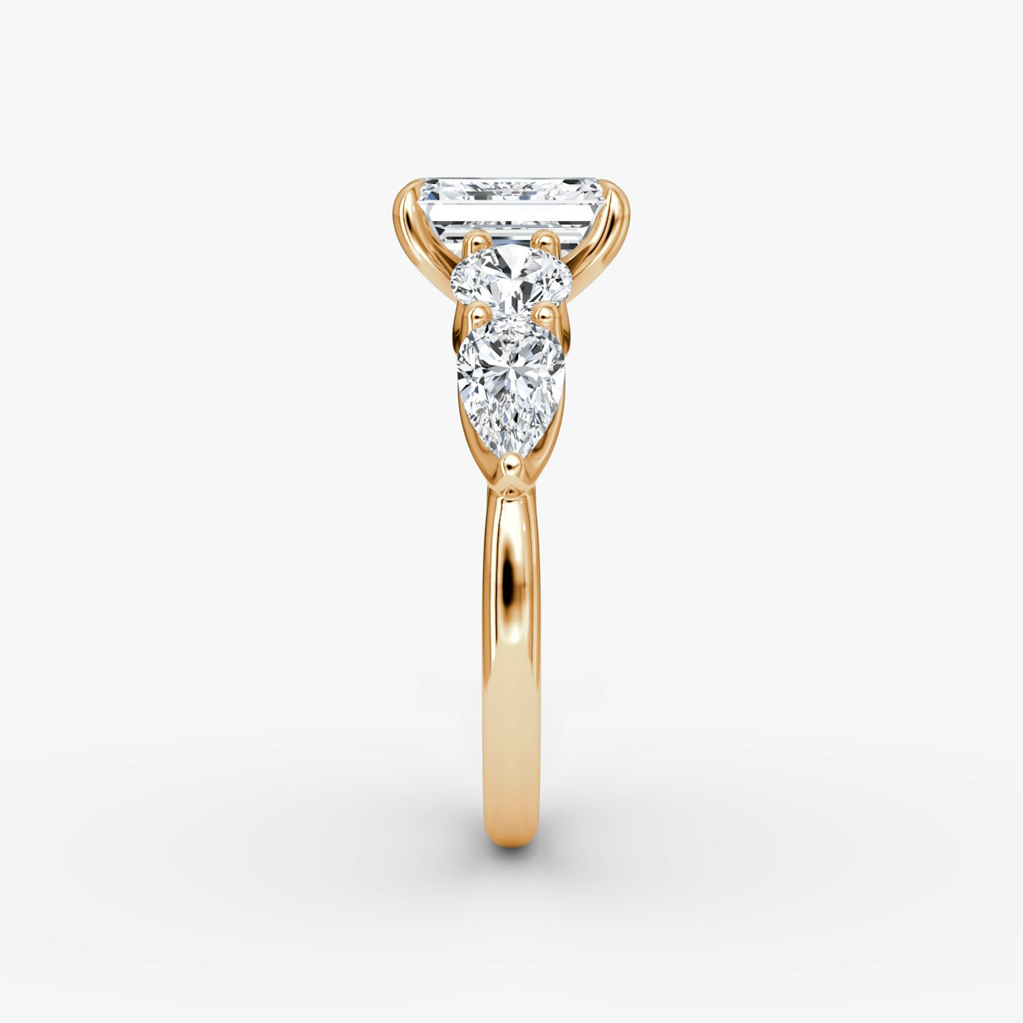 The Mixed Shape | Emerald | 14k | Rose Gold | bandAccent: Plain | sideStoneOrientation: horizontal | sideStoneShape: Round Brilliant and Pear | diamondOrientation: vertical | caratWeight: other