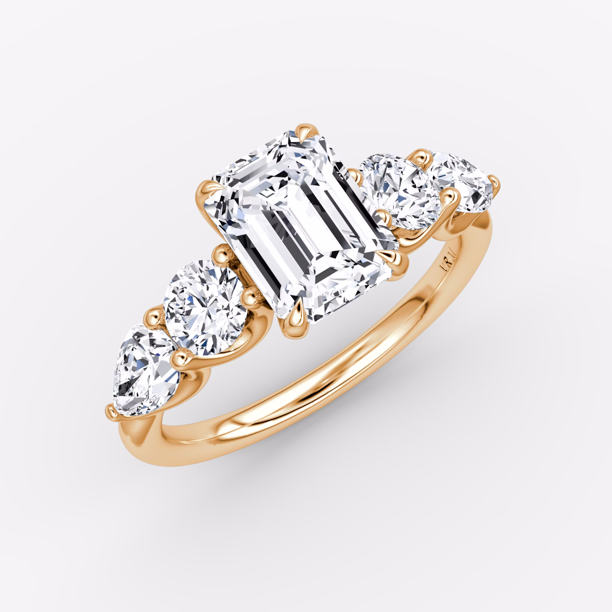 The Mixed Shape | Emerald | 14k | Rose Gold | bandAccent: Plain | sideStoneOrientation: horizontal | sideStoneShape: Round Brilliant and Pear | diamondOrientation: vertical | caratWeight: other