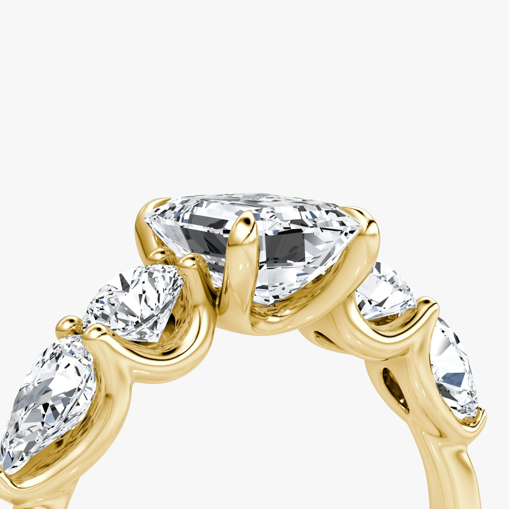 The Mixed Shape | Emerald | 18k | Yellow Gold | bandAccent: Plain | sideStoneOrientation: horizontal | sideStoneShape: Round Brilliant and Pear | diamondOrientation: vertical | caratWeight: other