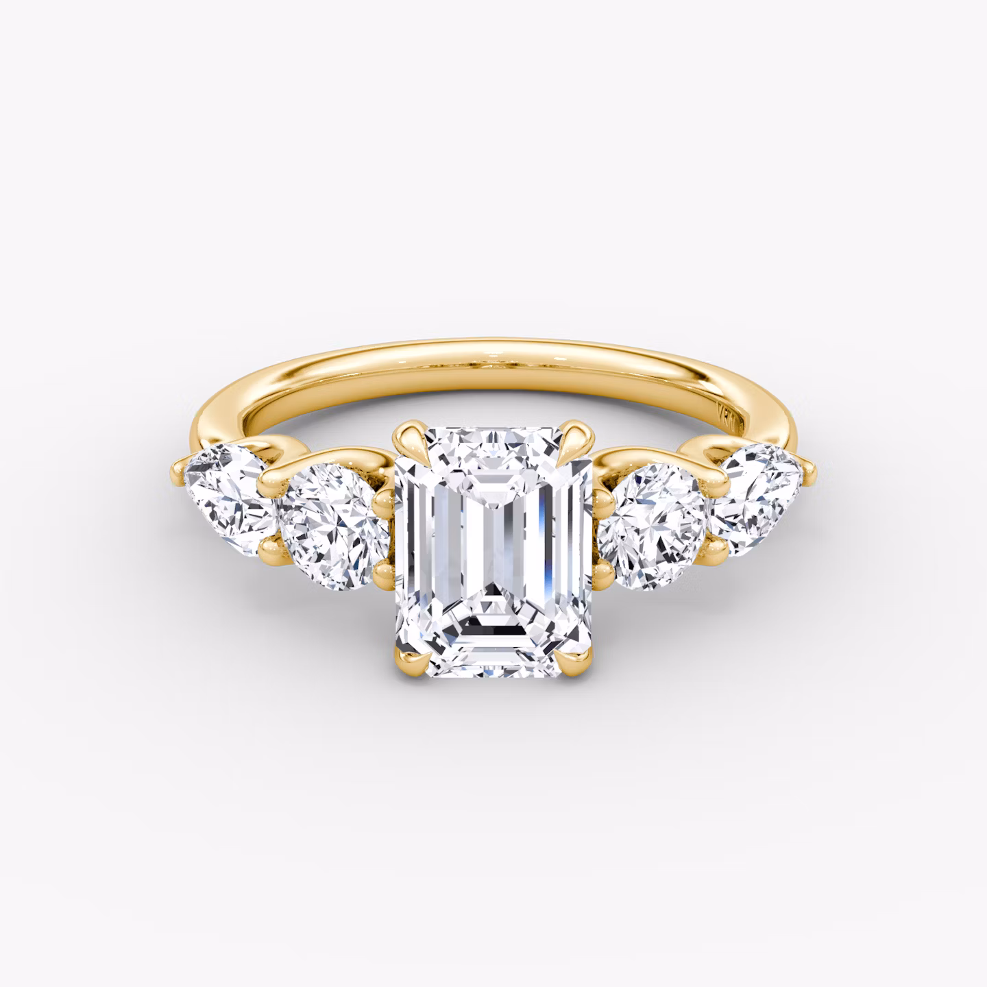The Mixed Shape | Emerald | 18k | Yellow Gold | bandAccent: Plain | sideStoneOrientation: horizontal | sideStoneShape: Round Brilliant and Pear | diamondOrientation: vertical | caratWeight: other