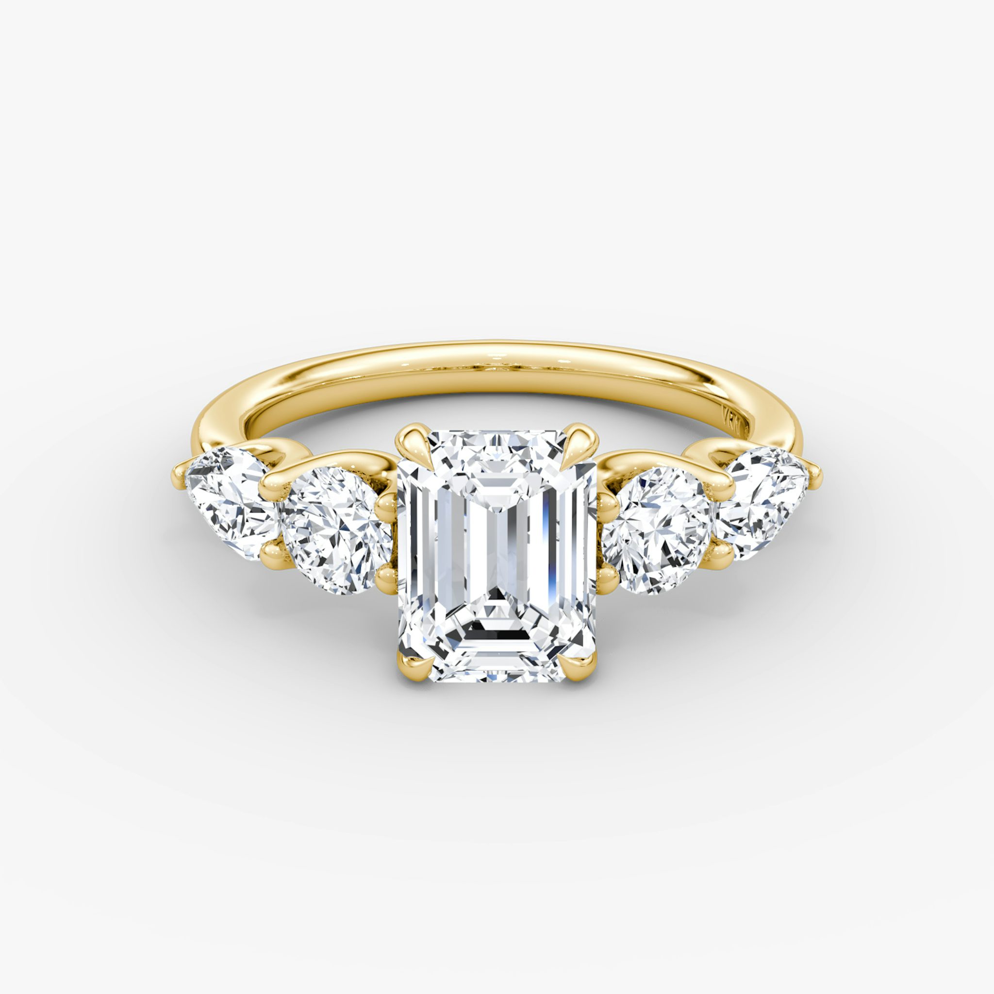 The Mixed Shape | Emerald | 18k | Yellow Gold | bandAccent: Plain | sideStoneOrientation: horizontal | sideStoneShape: Round Brilliant and Pear | diamondOrientation: vertical | caratWeight: other