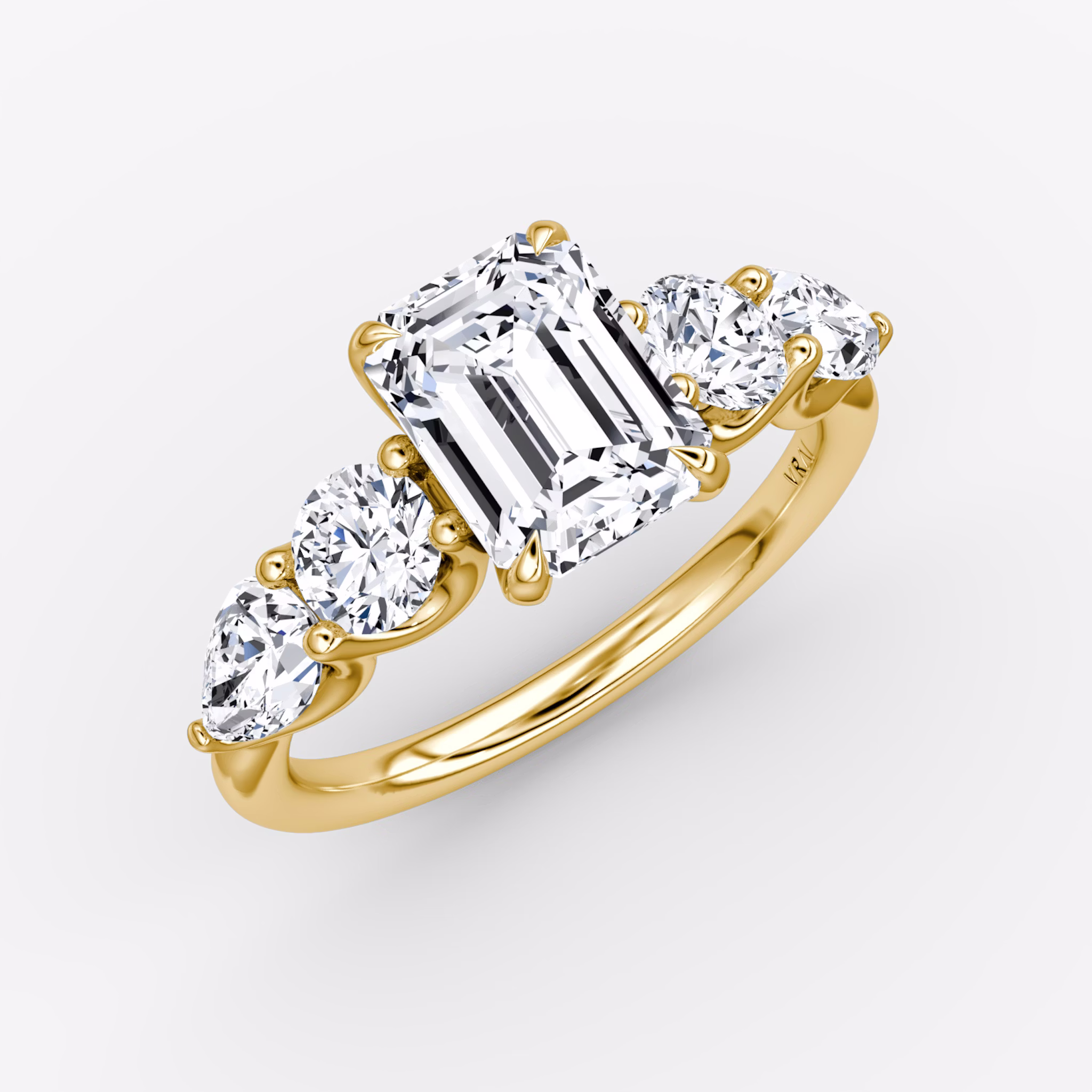 The Mixed Shape | Emerald | 18k | Yellow Gold | bandAccent: Plain | sideStoneOrientation: horizontal | sideStoneShape: Round Brilliant and Pear | diamondOrientation: vertical | caratWeight: other